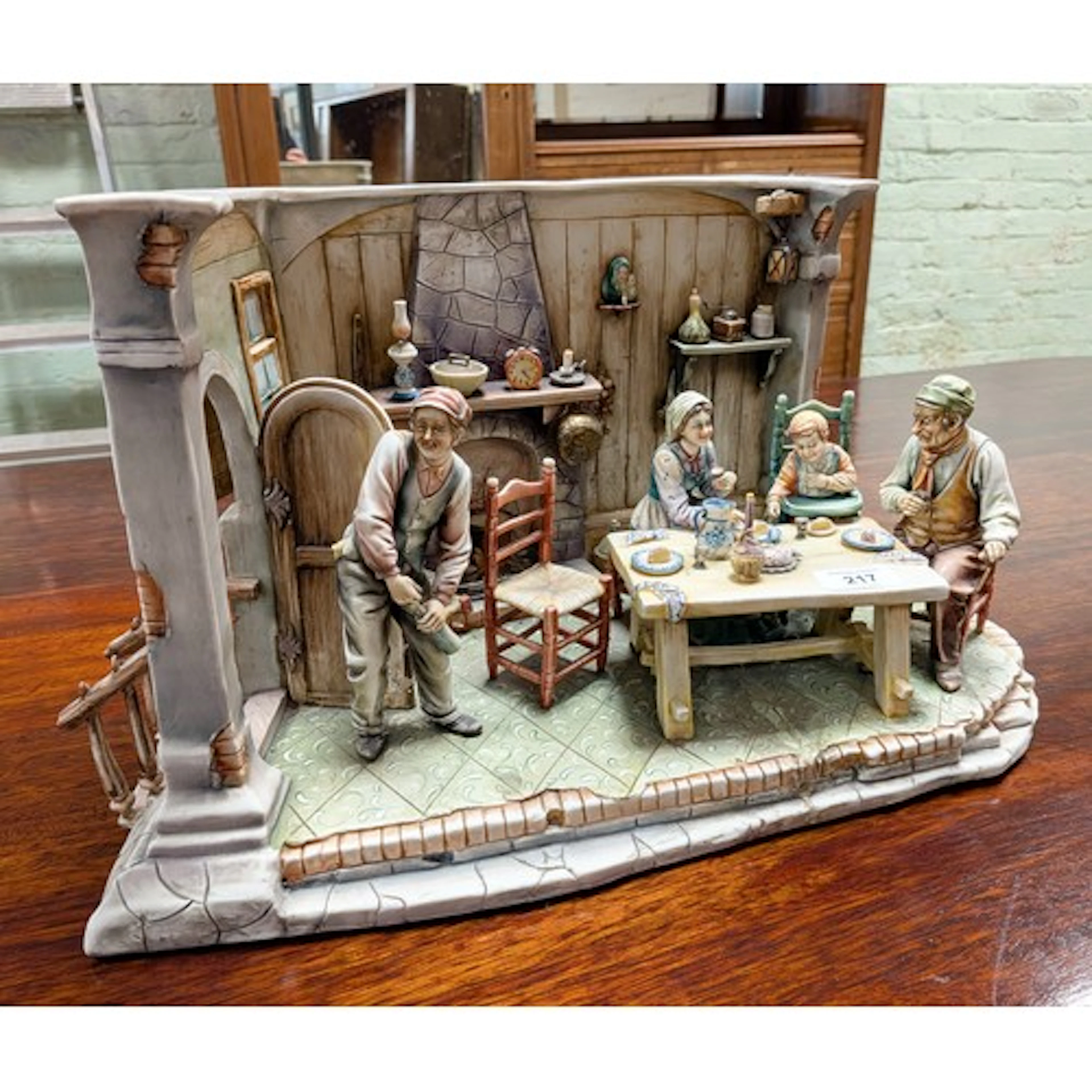 A large Capodimonte diorama figurine of a interior scene, ap...