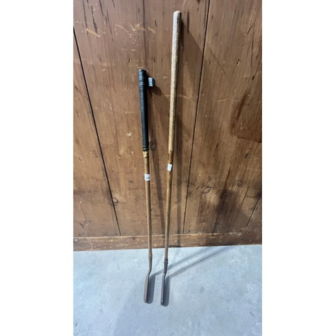 Two hickory shafted golf clubs.
