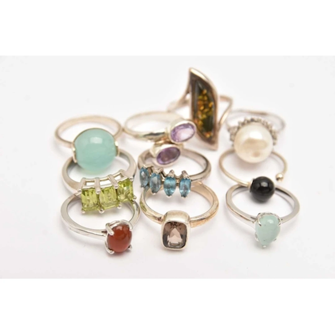 NINE WHITE METAL GEM SET RINGS, each stamped 925, set with s...
