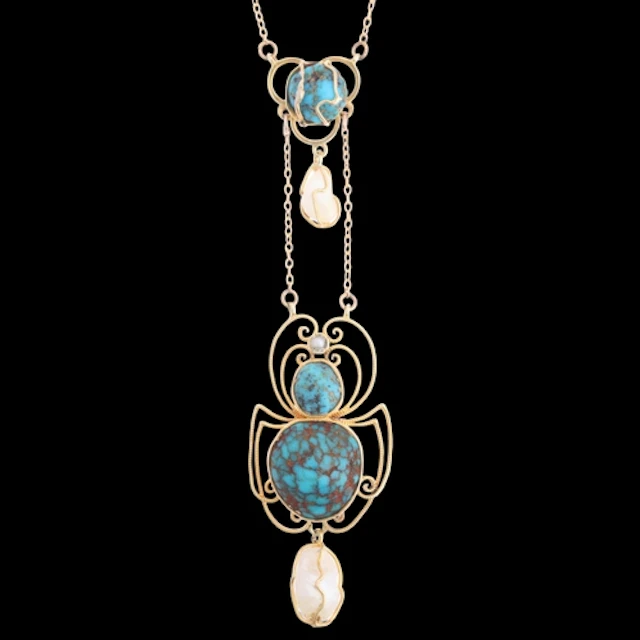 An Art Nouveau 15ct gold turquoise and pearl 'Spider' lavali...