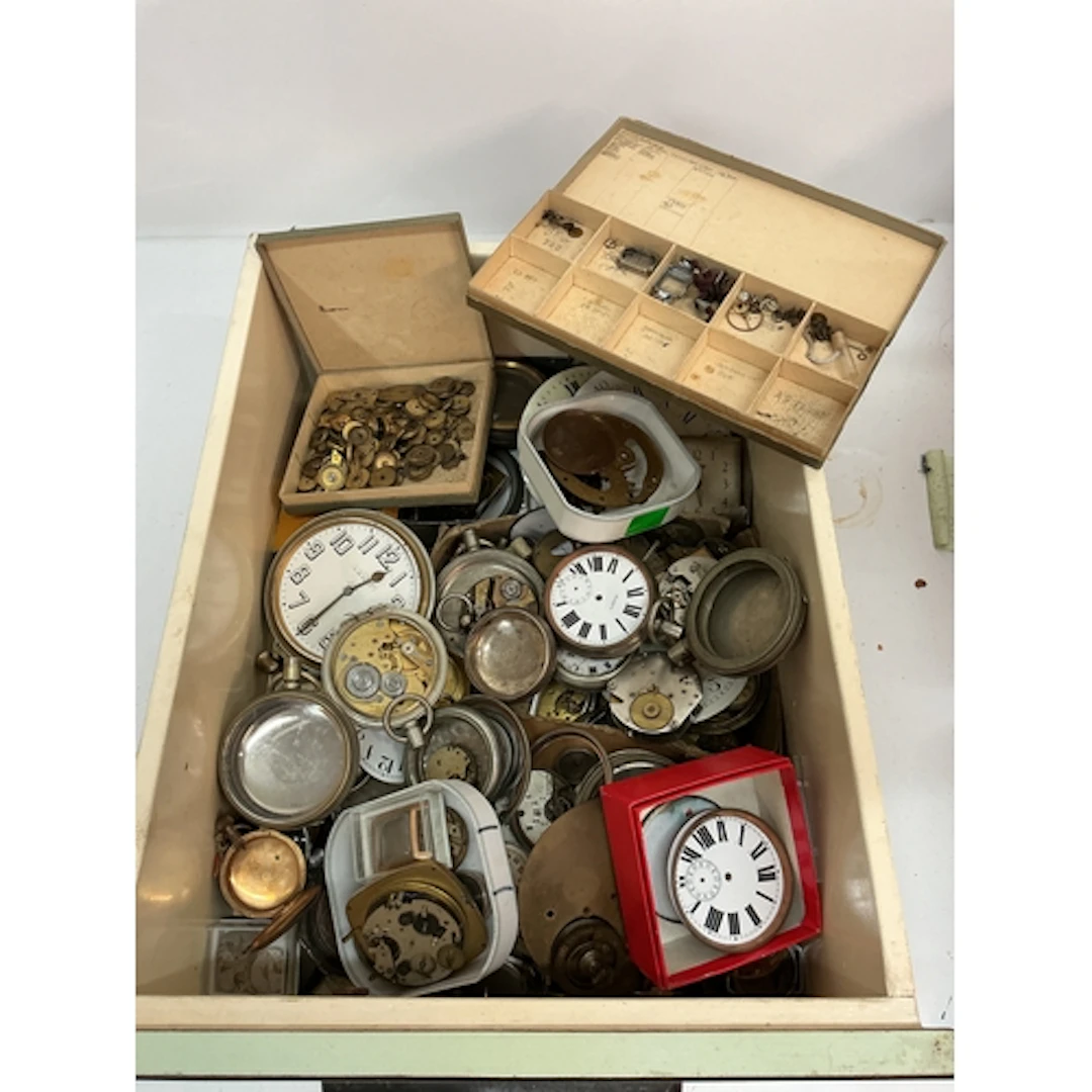 A tray of assorted vintage Goliath watch cases and parts. Of...