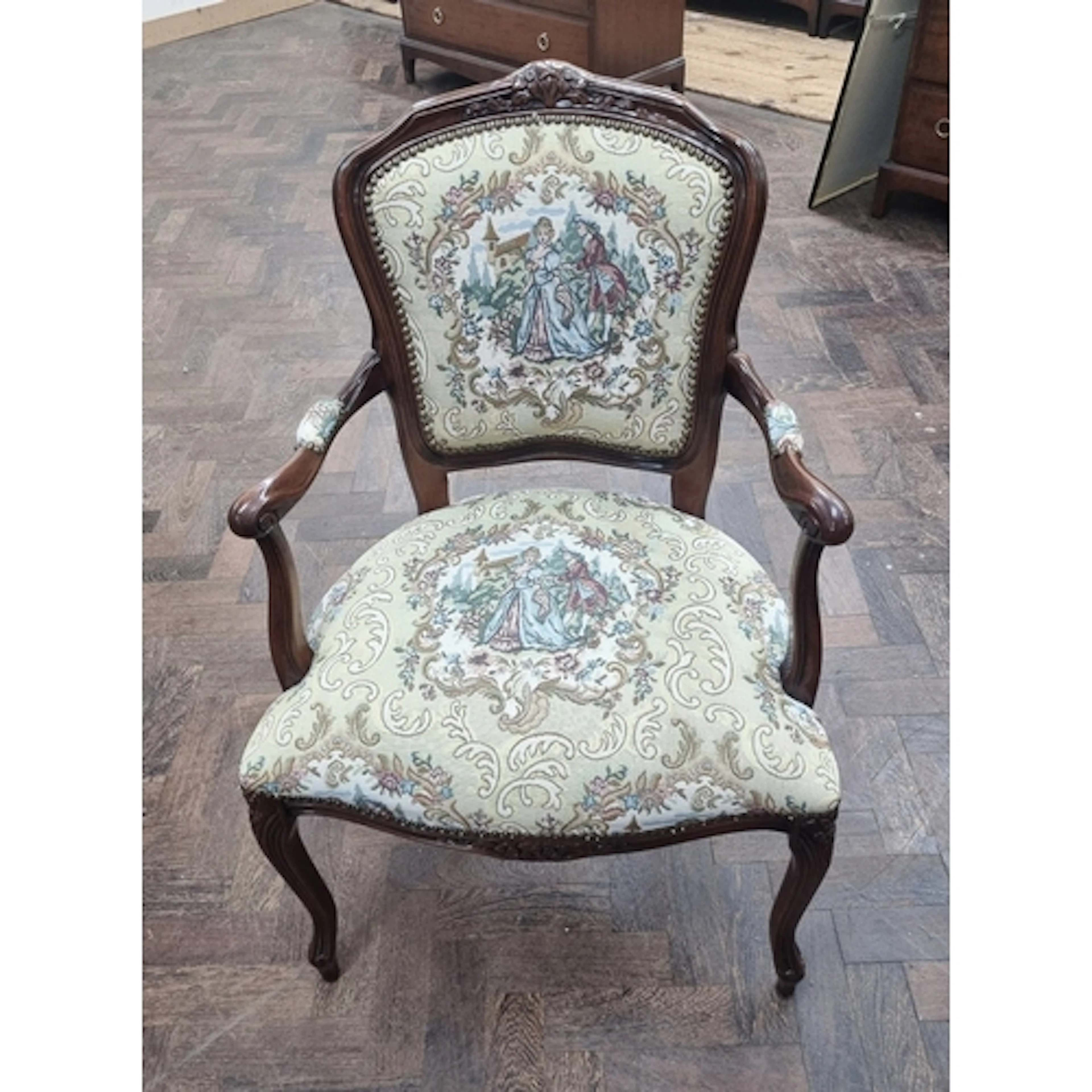 A French style mahogany framed elbow chair with tapestry uph...