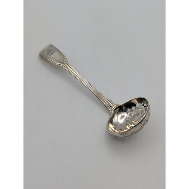 A George III silver sugar sifter spoon, having engraved cres...
