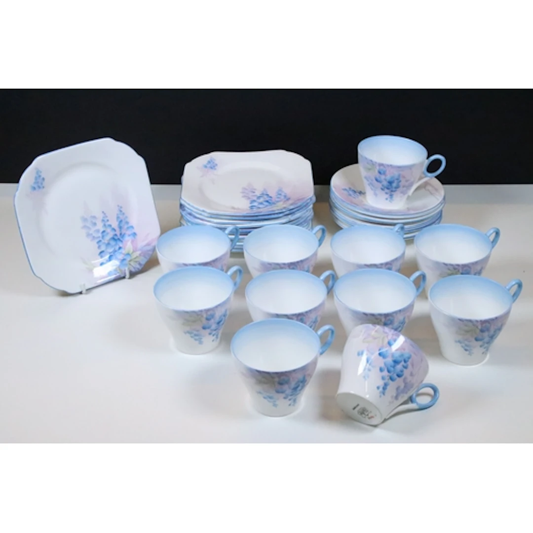 Shelley Art Deco floral pattern tea set, having twelve tea c...