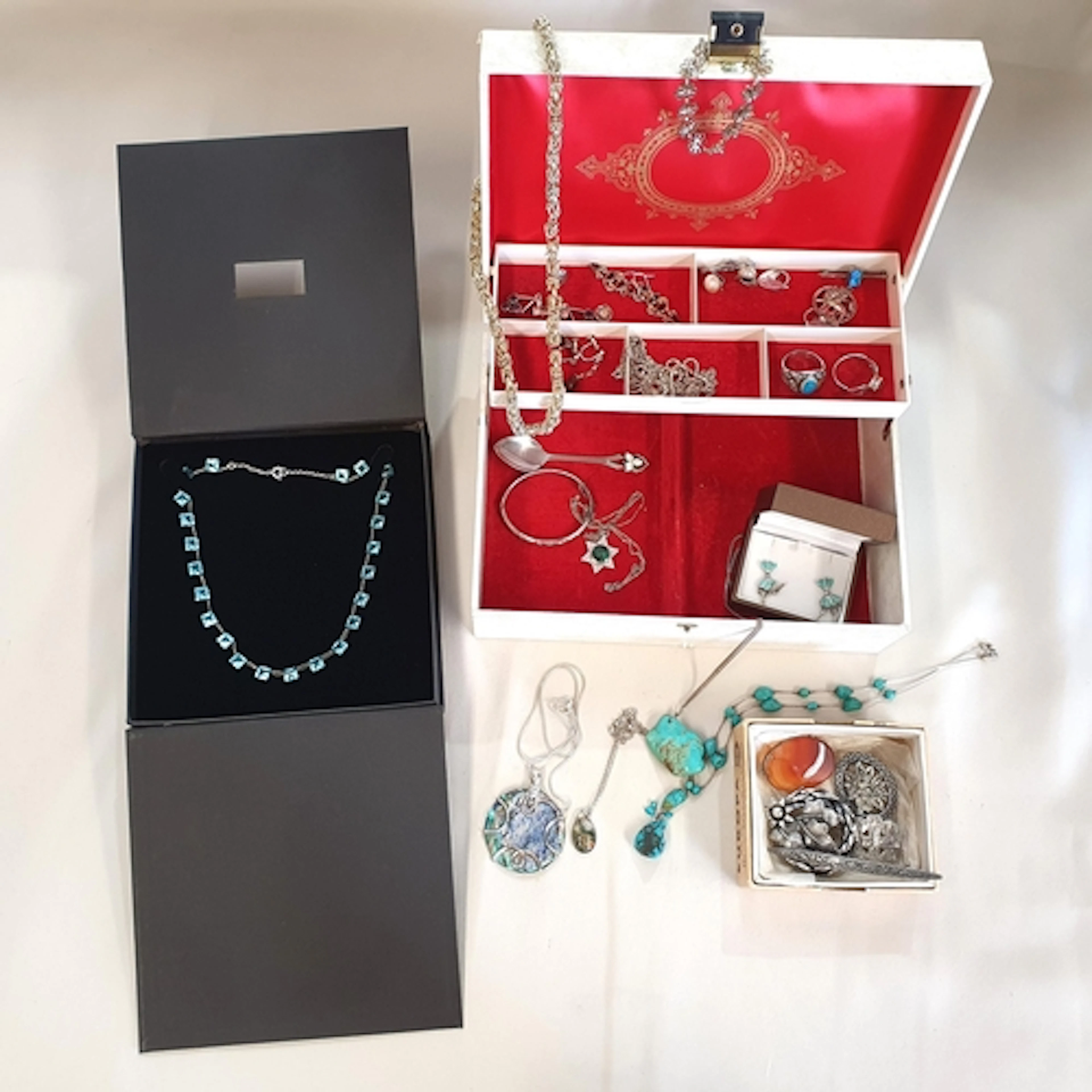 A Jewel Box containing a number of items in silver or stampe...