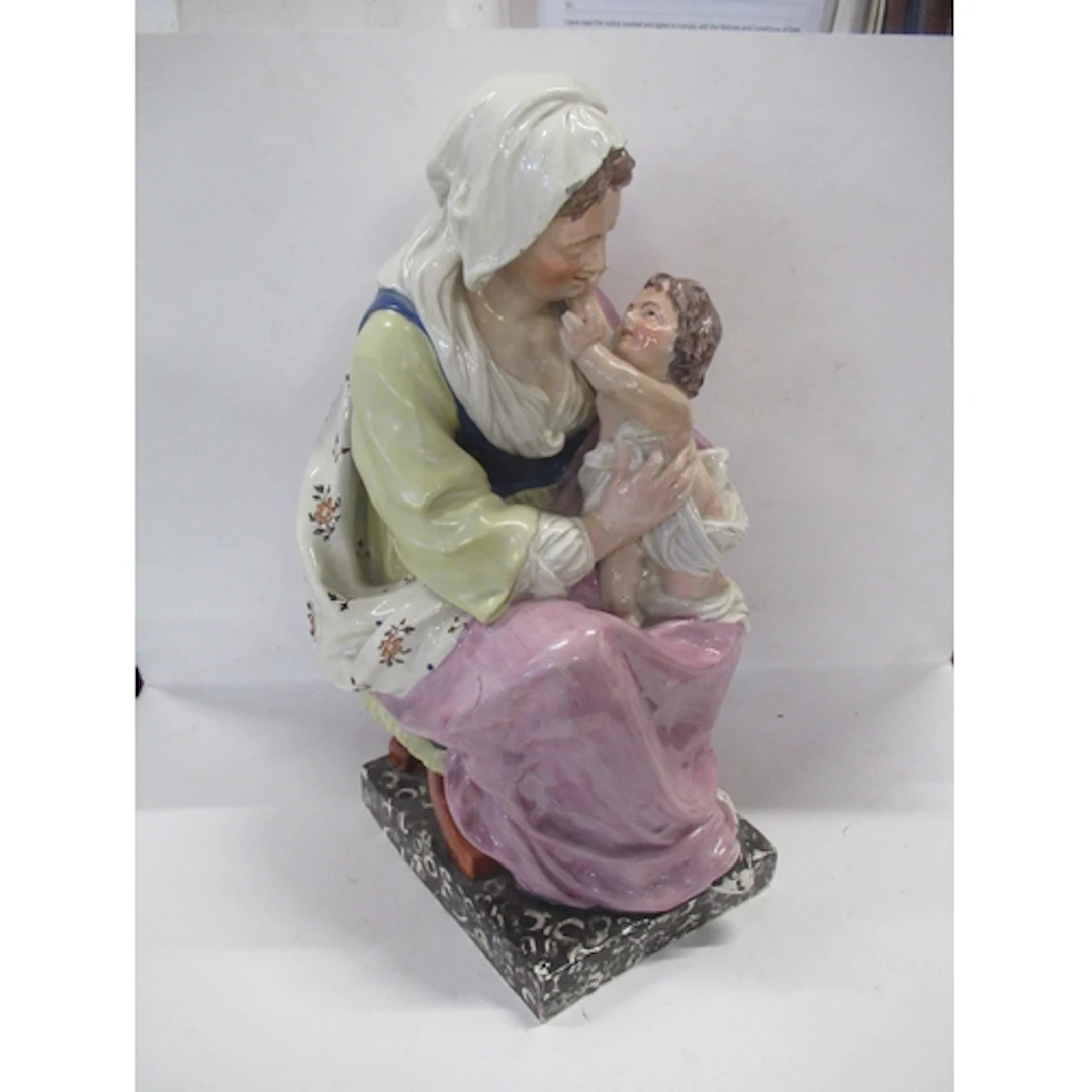 A 19th century Staffordshire pearlware model, Madonna and Ch...