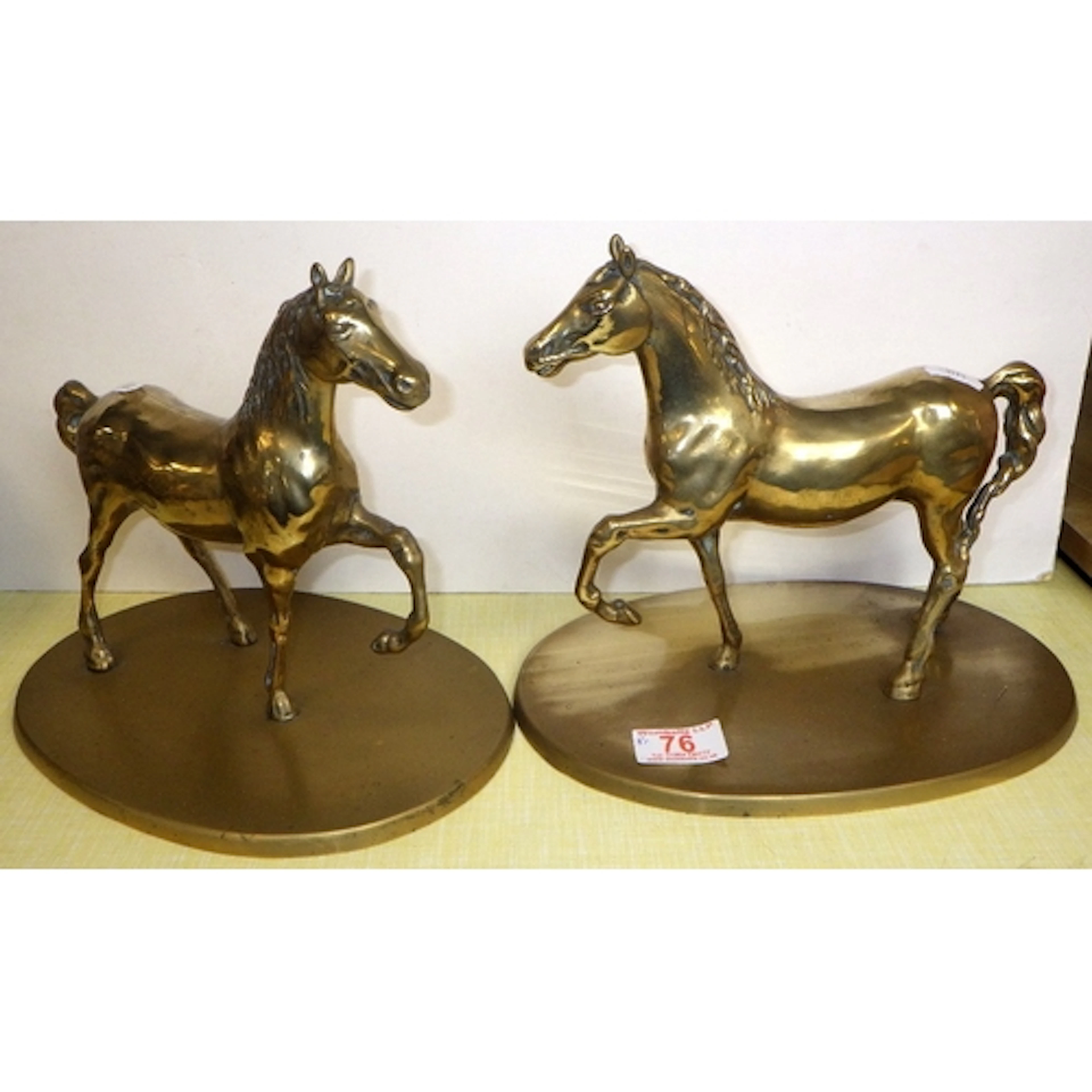 A pair of brass horse figures