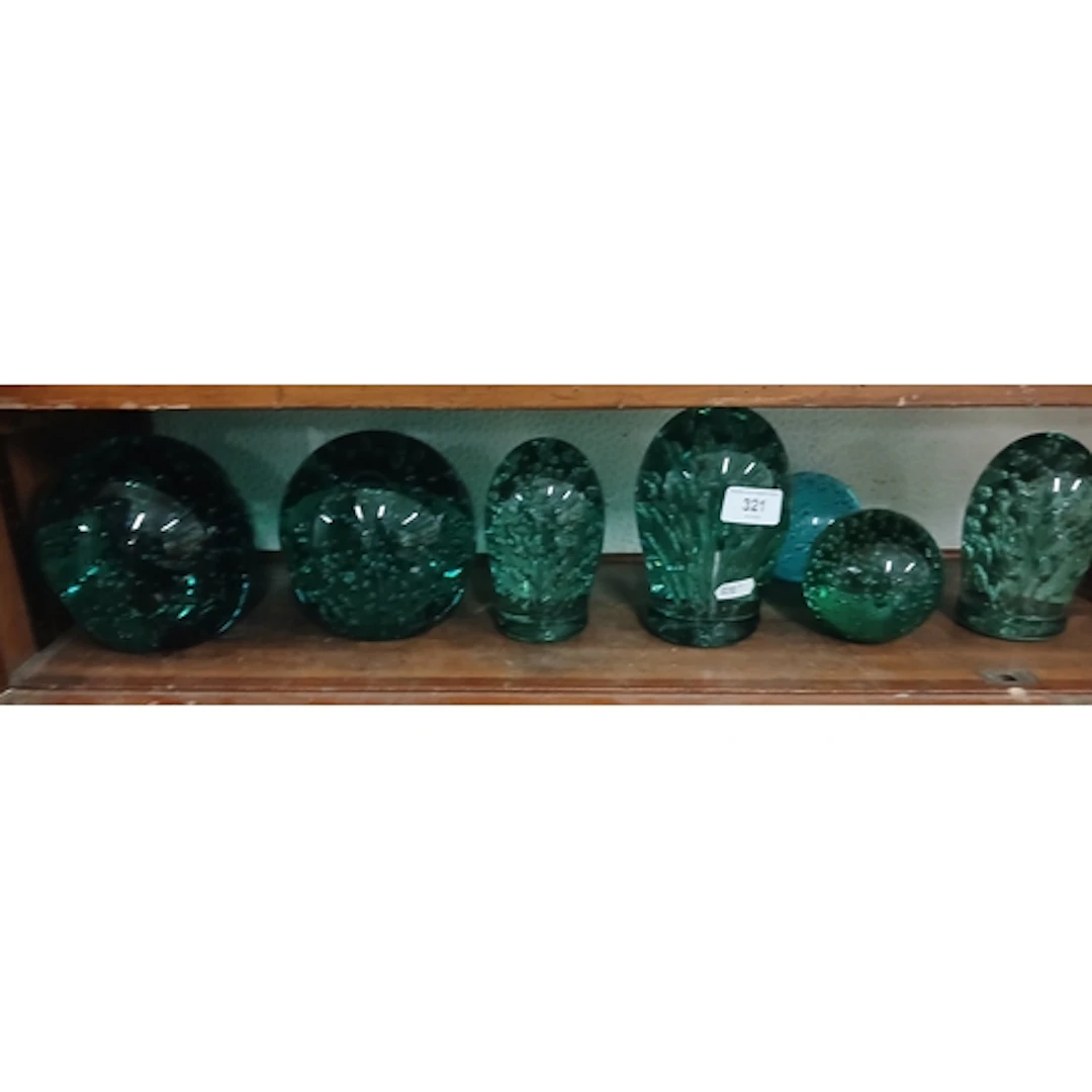 7 vintage glass dumps in various shades of green.
