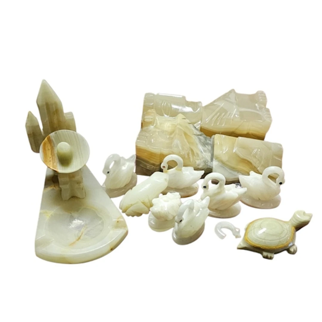 A PAIR OF MID CENTURY SOUTH AMERICAN CARVED ONYX FIGURAL BOO...