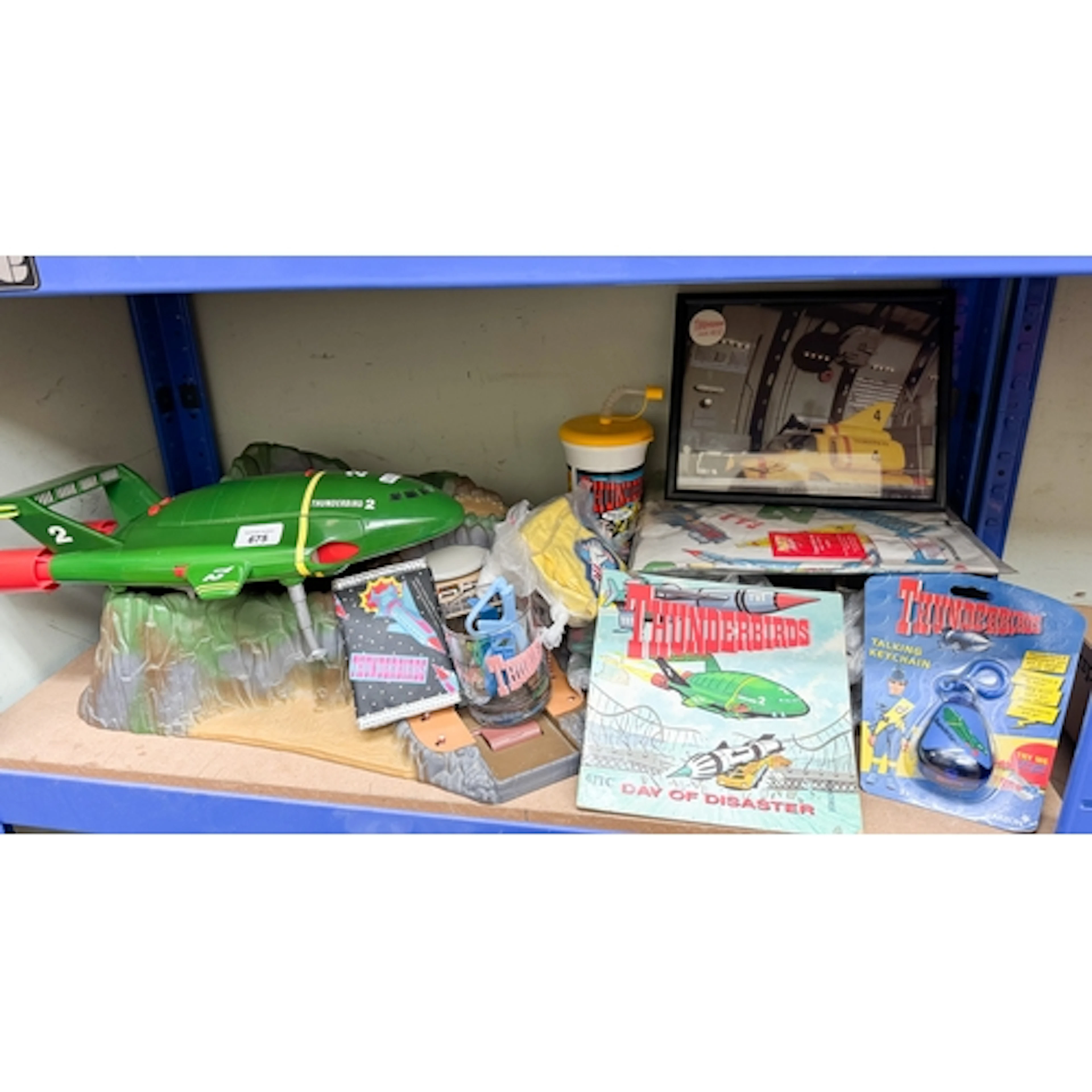 A large quantity of assorted Thunderbirds memorabilia to inc...