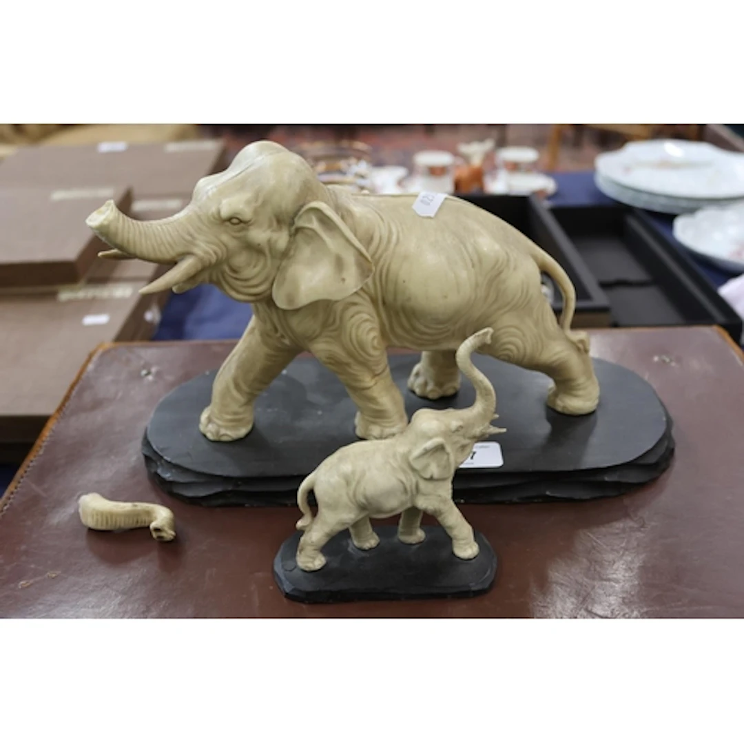 Two composite models of elephants, marked John E Esselemont ...