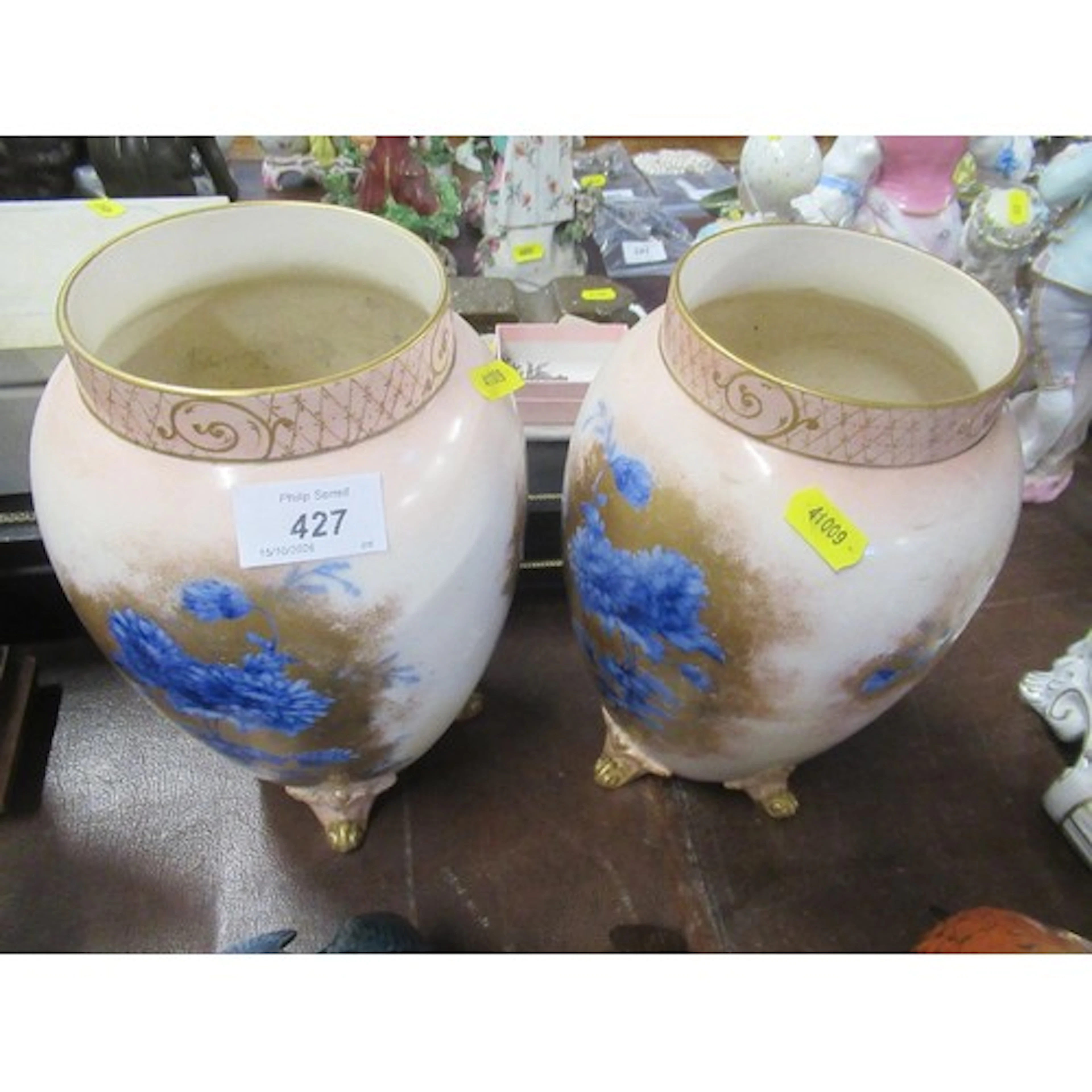 A pair of Victorian vases, decorated with flowers