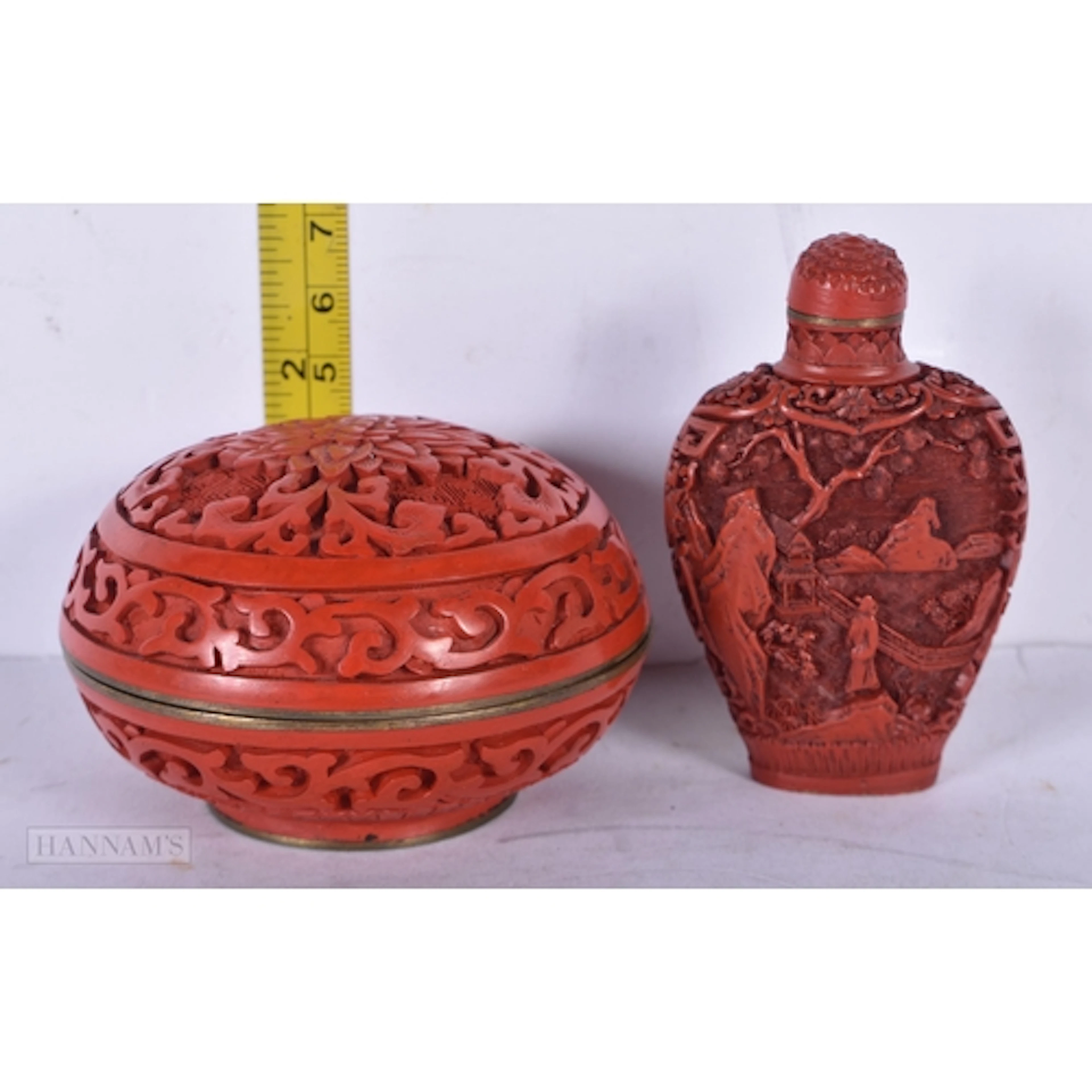A Chinese Cinnabar cosmetic pot together with a Cinnabar snu...
