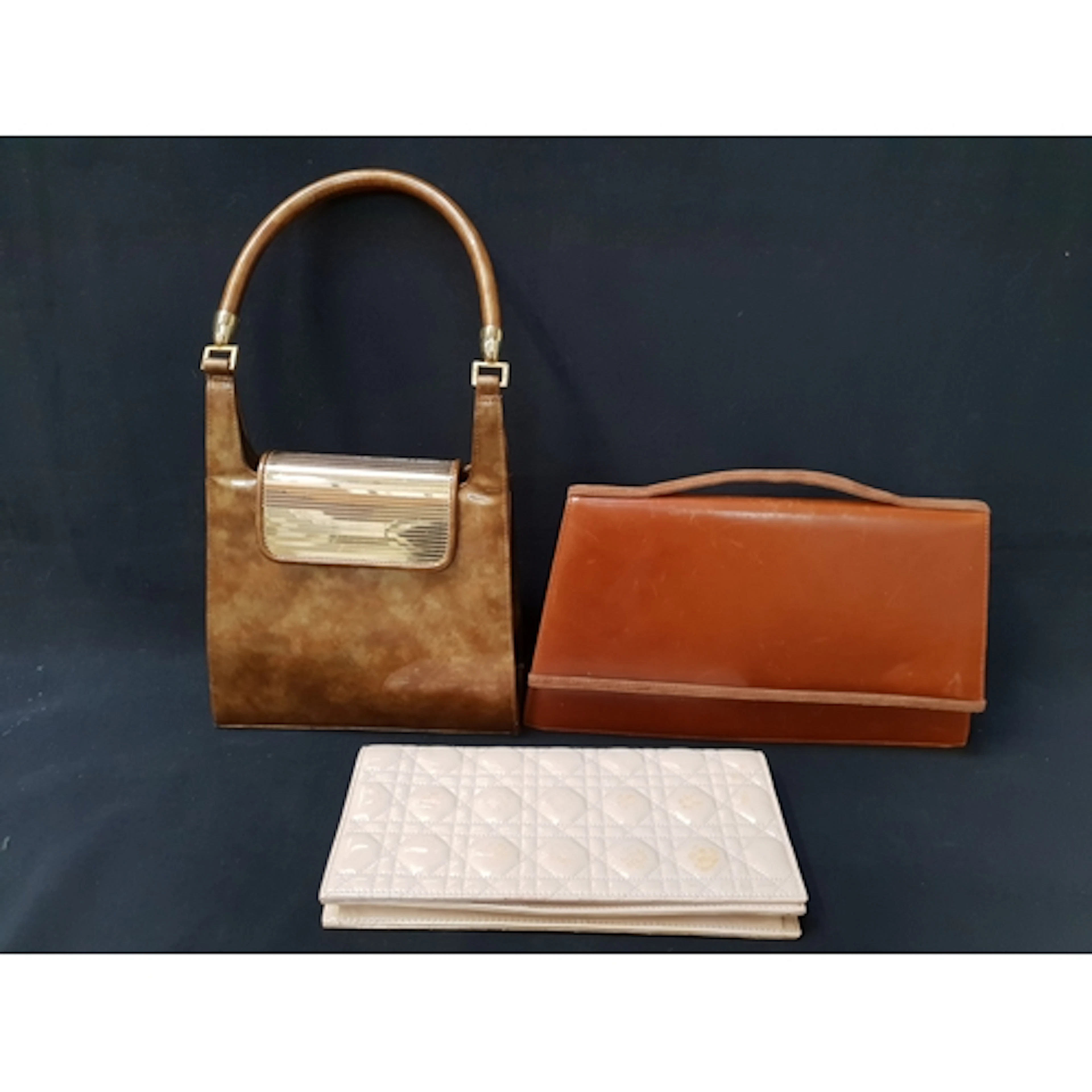 THREE VINTAGE DESIGNER HANDBAGS comprising a Stuart Weitzman...