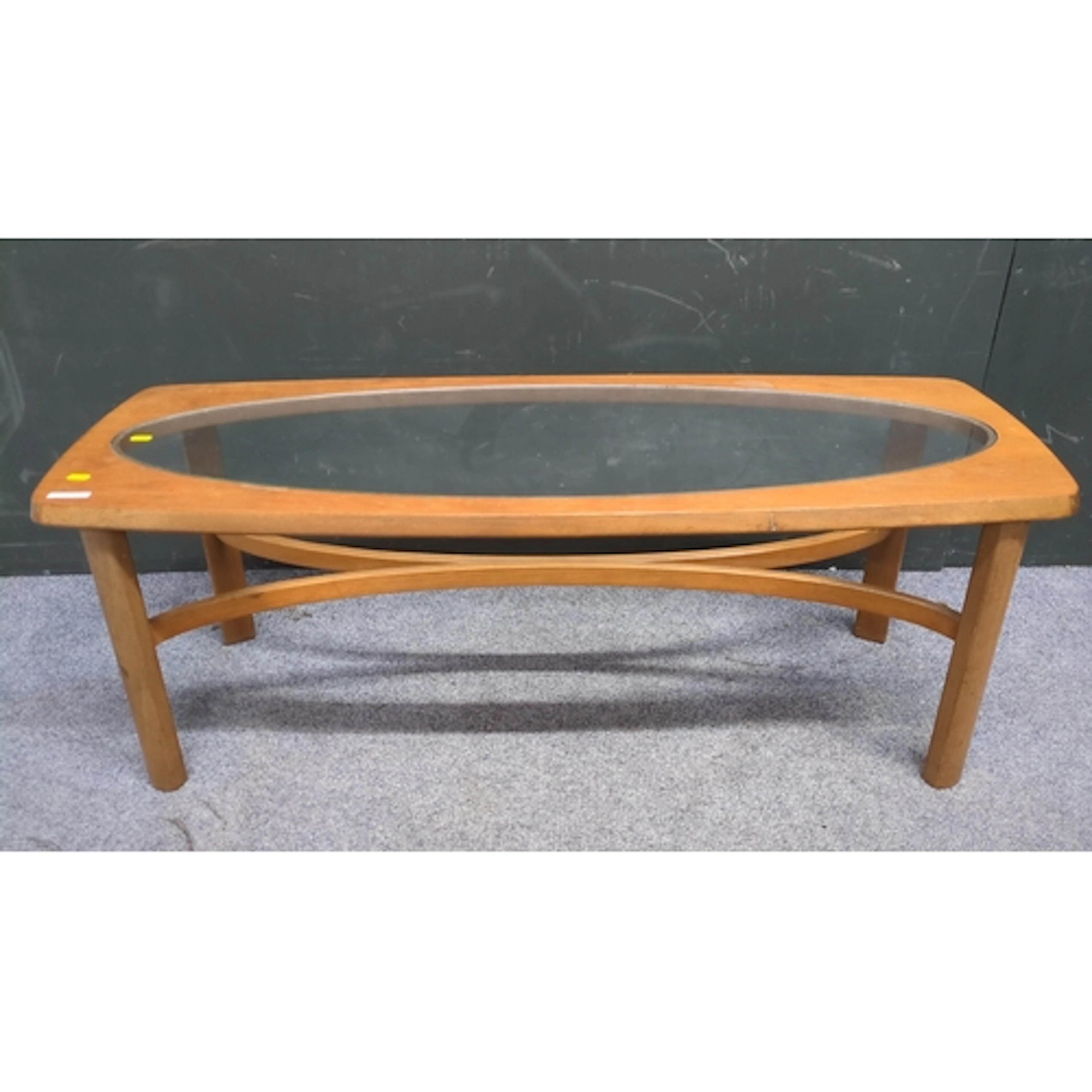 Mid-century coffee table, the top with rounded corners and o...