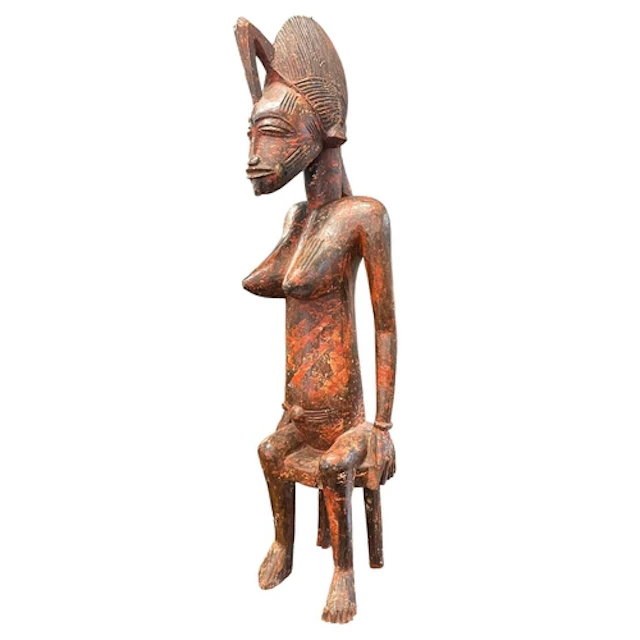 A large vintage 20th century African carved wood sculpture. ...