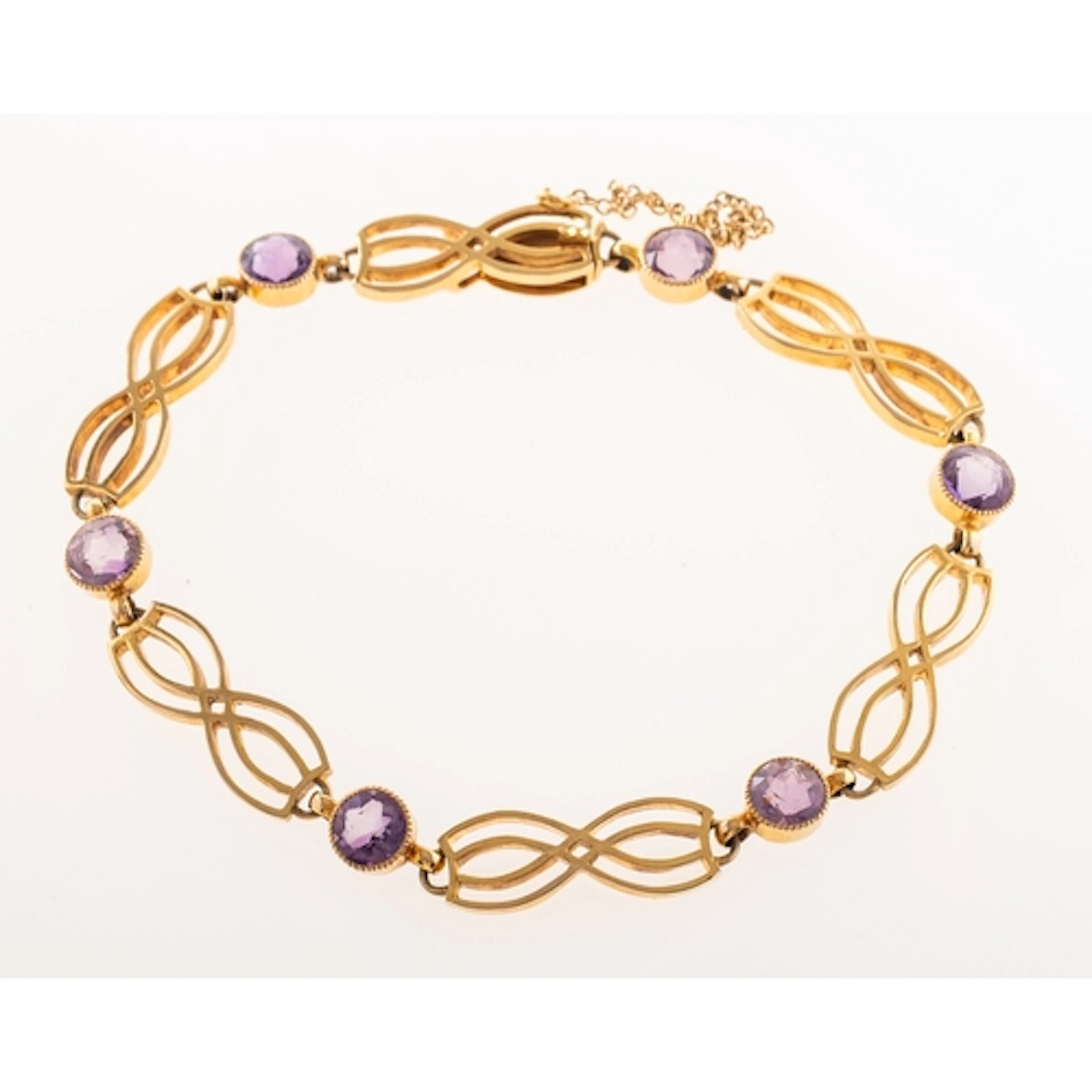 An Art Nouveau style bracelet, the articulated openwork scro...