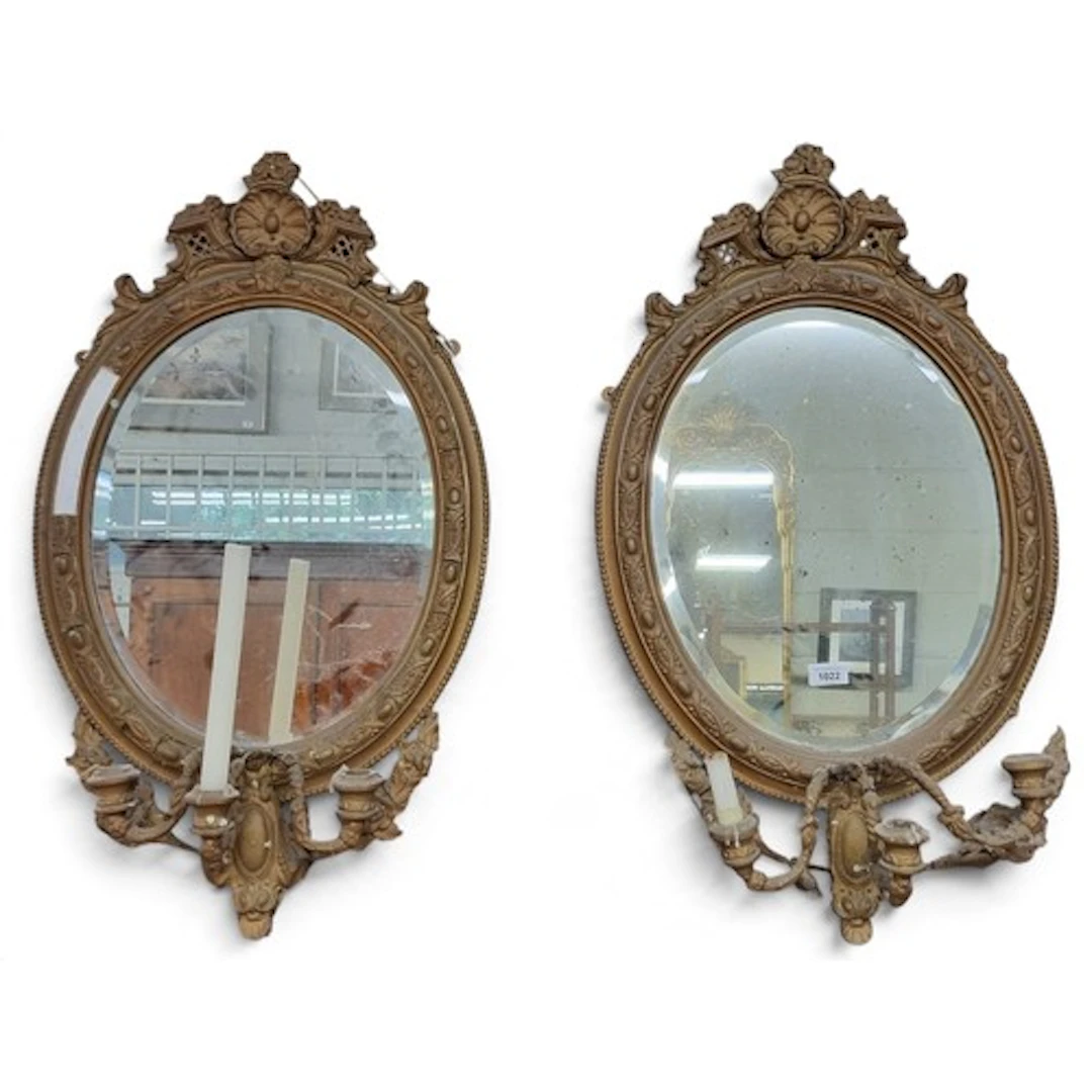 A pair of 19th Century oval Girandole Mirrors in need of som...