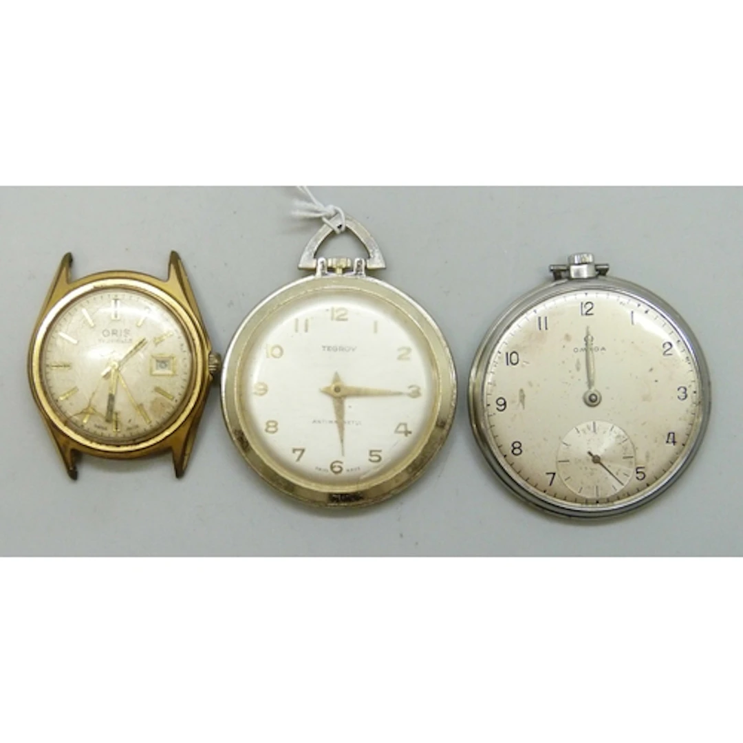 An Omega top wind dress pocket watch, lacking glass, an Oris...