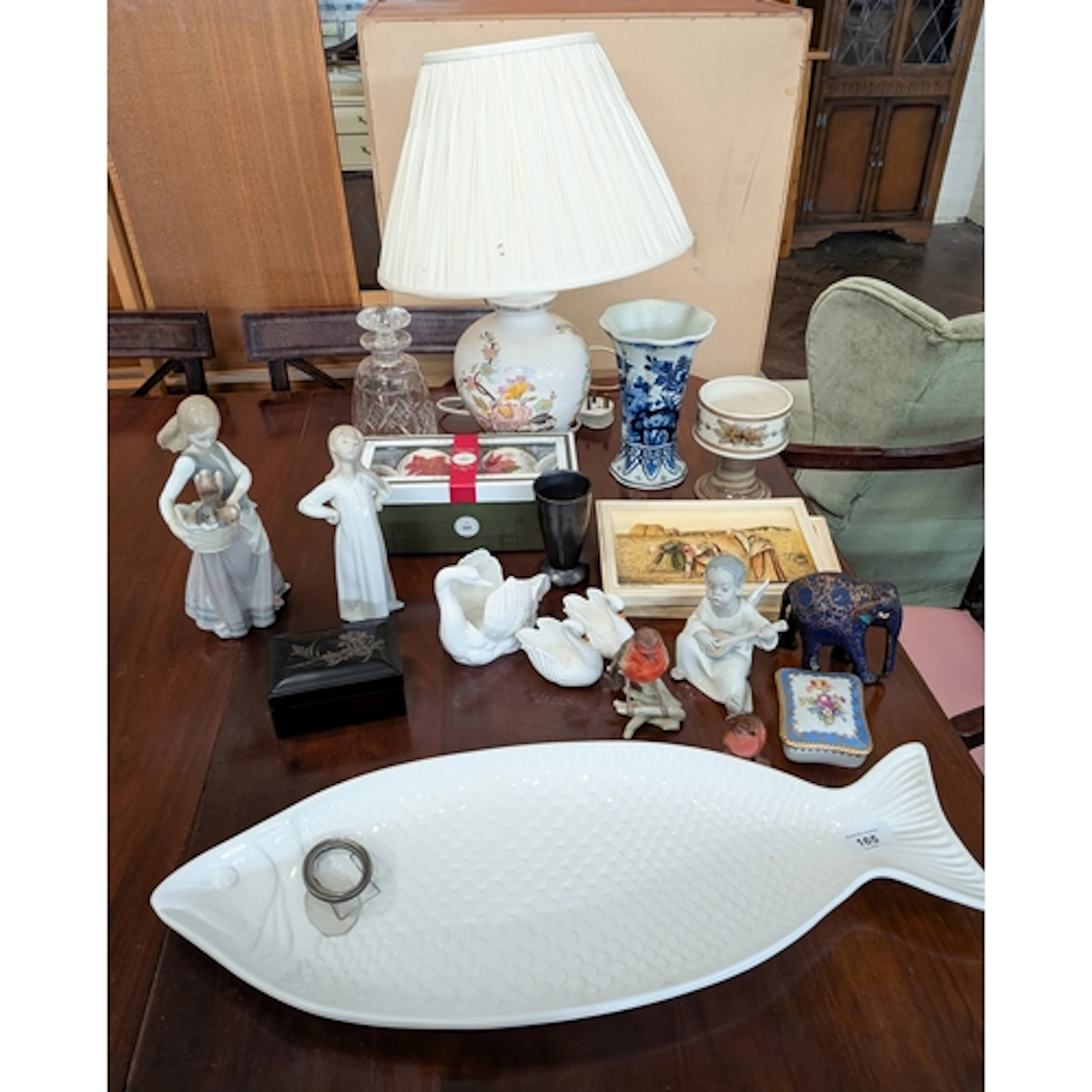 Table lamp, Lladro and other figurines, large white fish ser...
