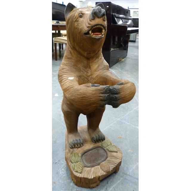 Carved wooden umbrella stand in the form of a Black Forest b...