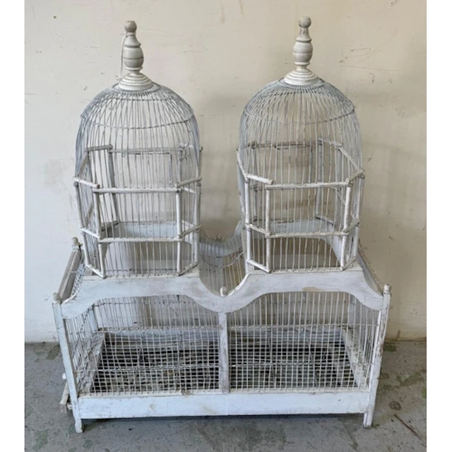 A white double domed bird cage. Height 96cm