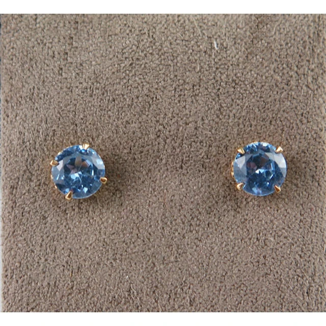 A pair of aqua marine? stud earrings in 9ct yellow gold moun...