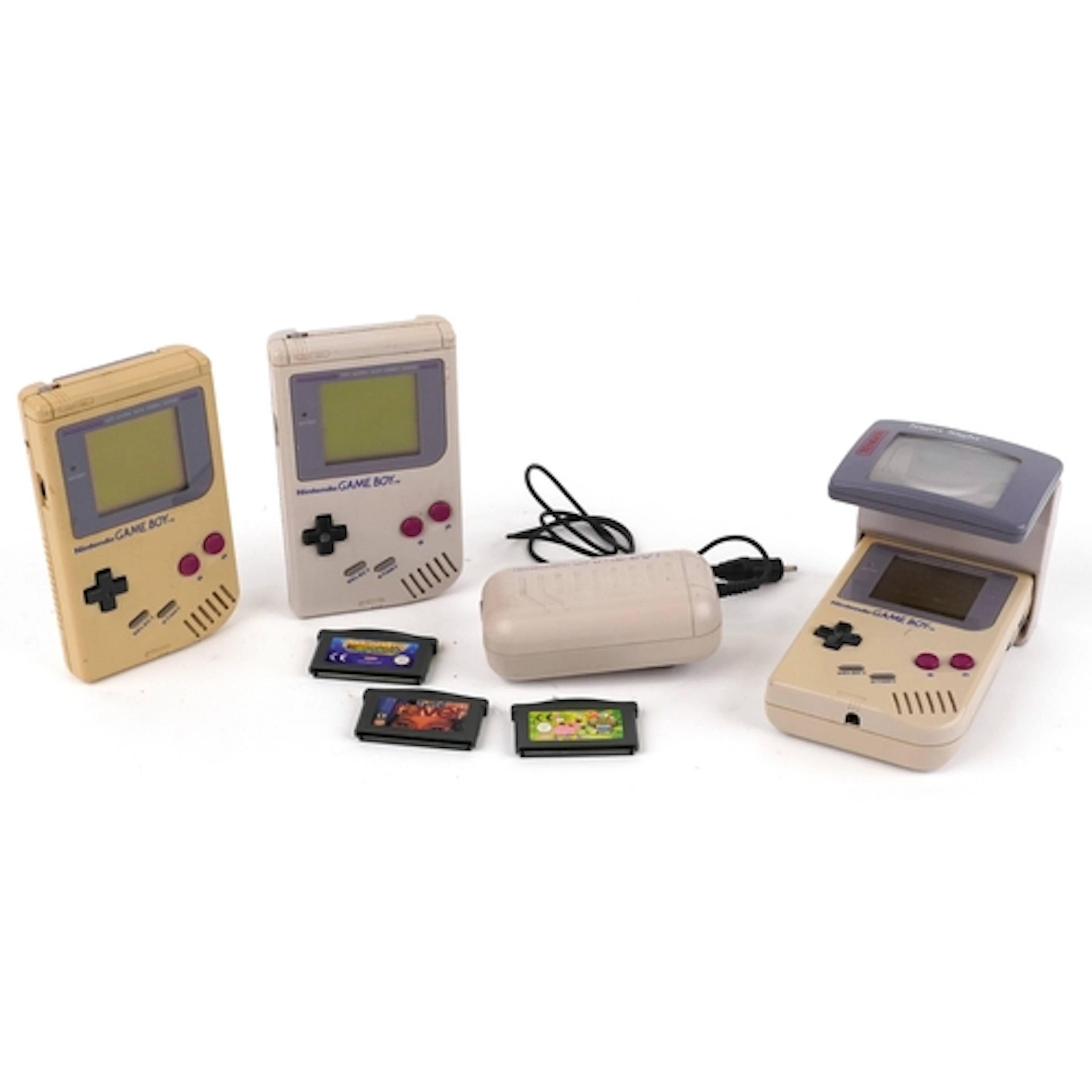 Three vintage Nintendo Gameboy games consoles with Nintendo ...