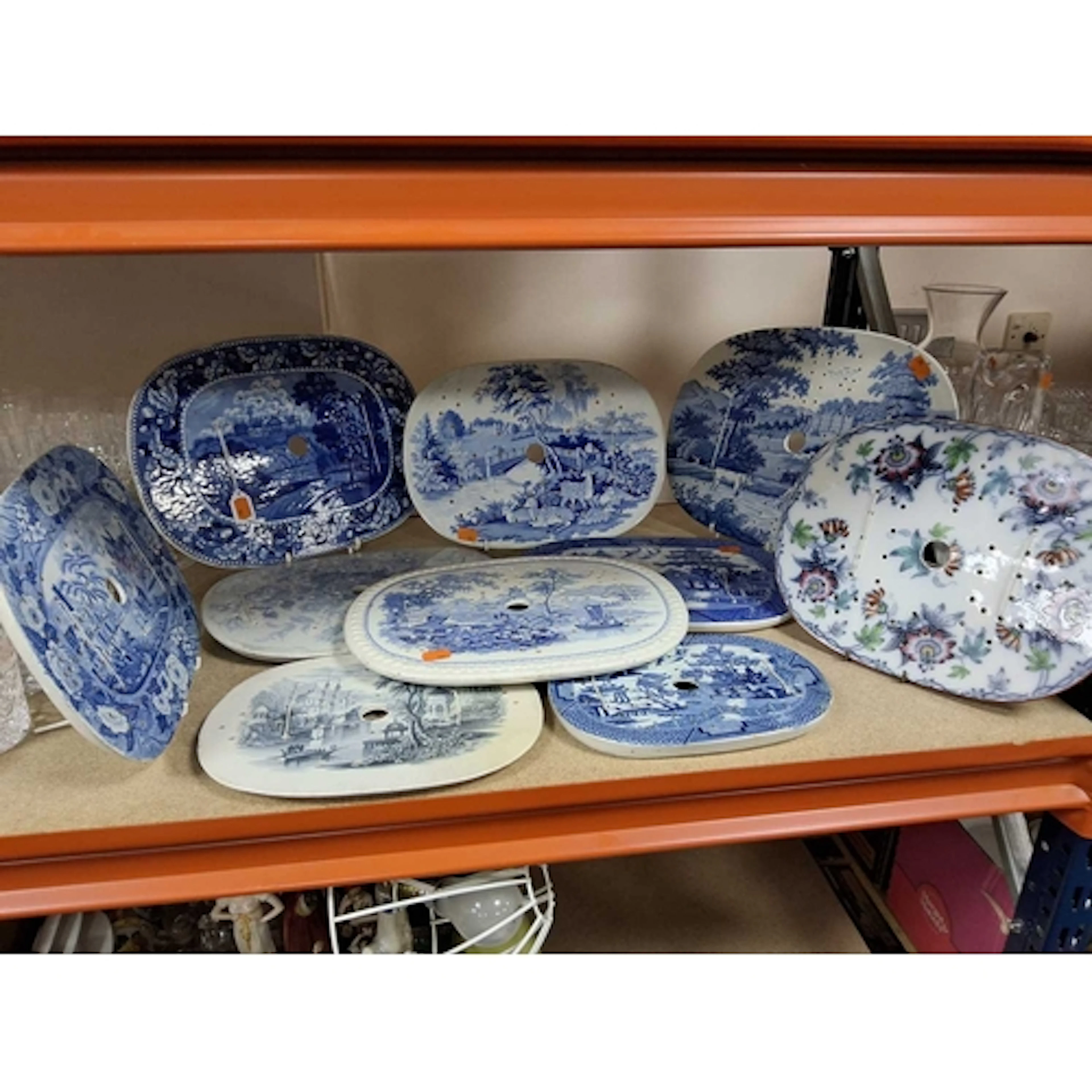 A GROUP OF TEN RARE MOSTLY 19TH CENTURY CERAMIC MEAT DRAINER...