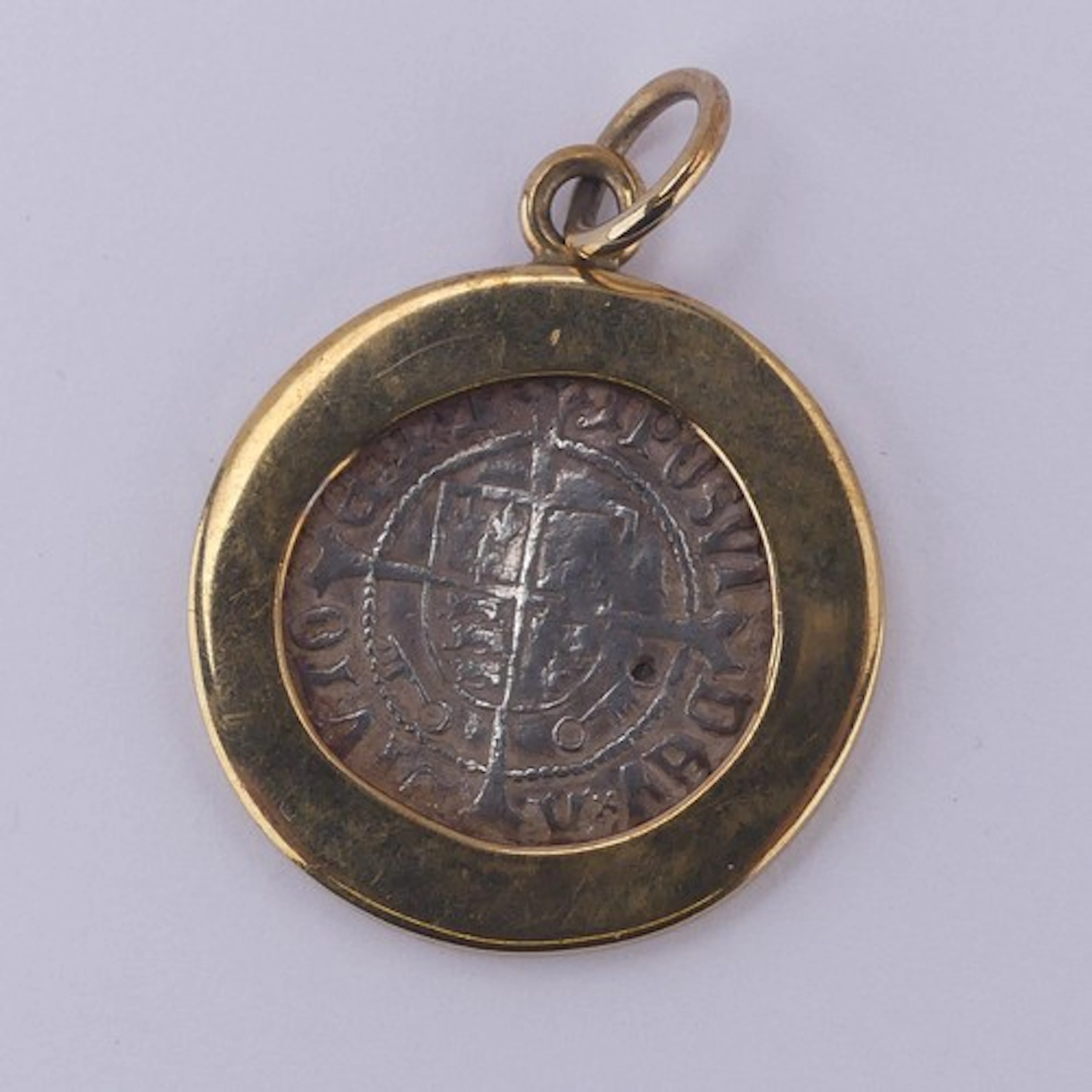 A Medieval hammered coin Pendant, enclosed in circular gold ...