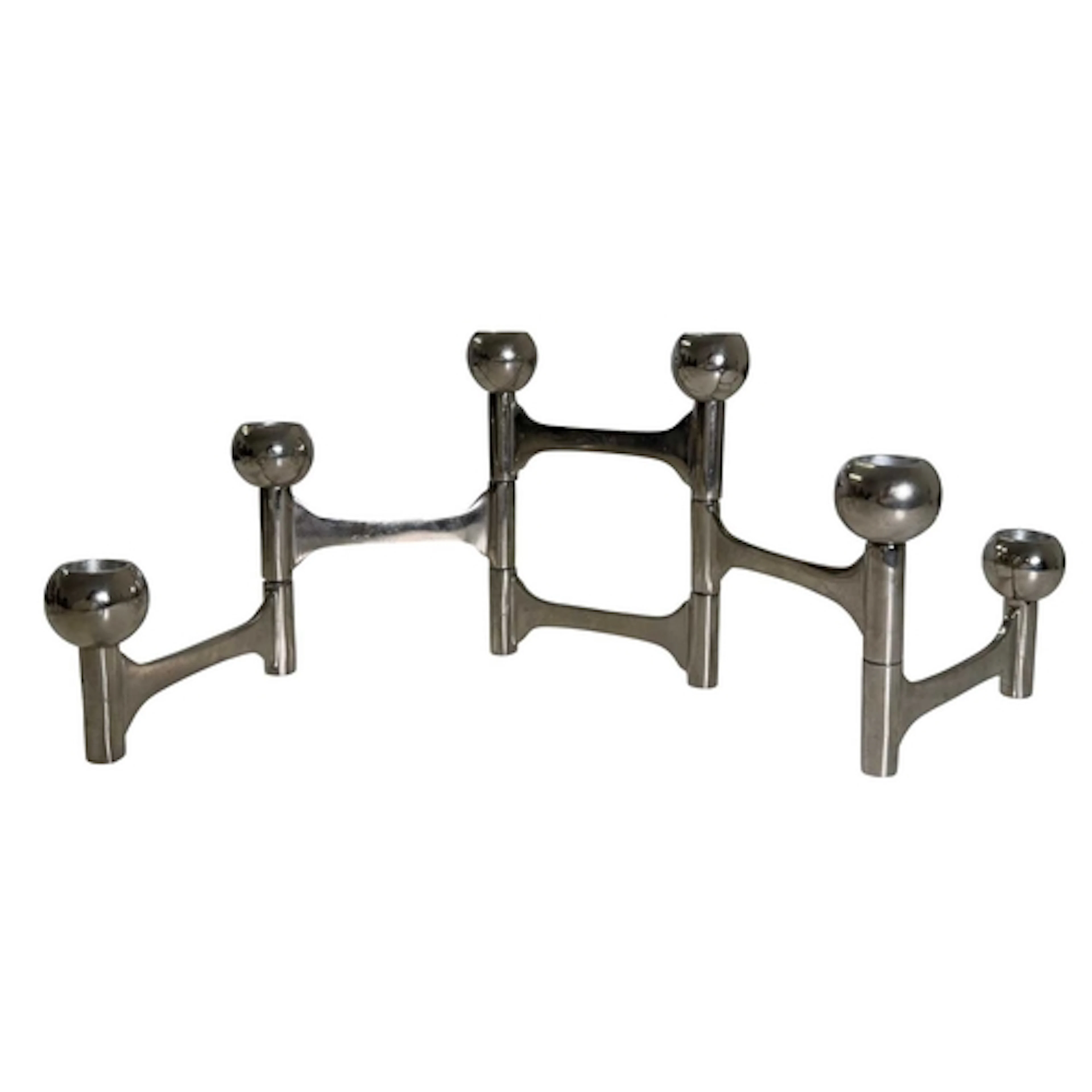 A set of modern designer metamorphic candlesticks or candle ...
