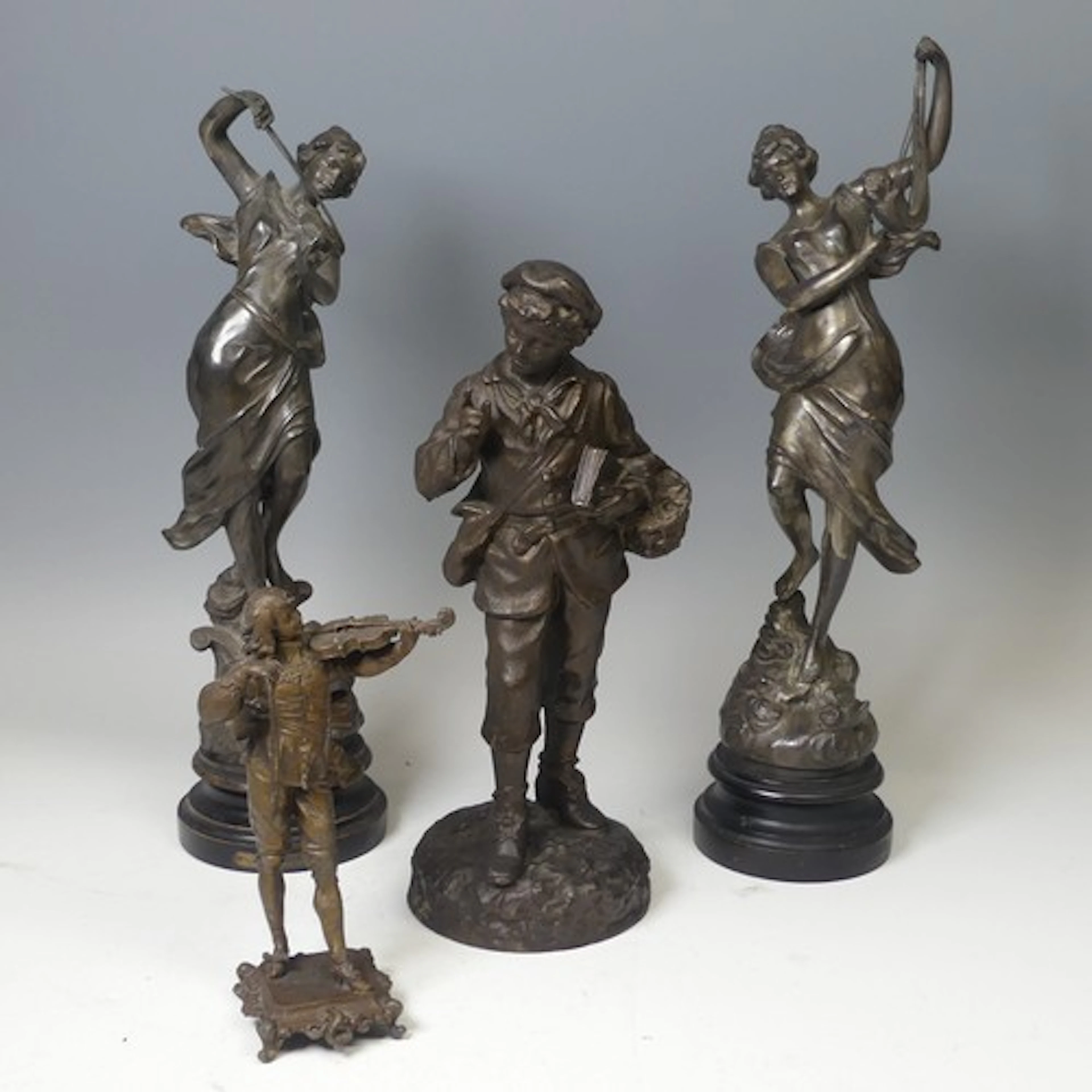 A pair of French spelter Figures on wooden mounts, in the fo...