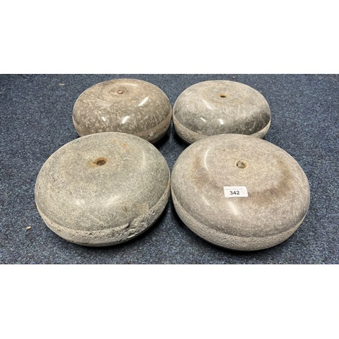 Group of four curling stones.