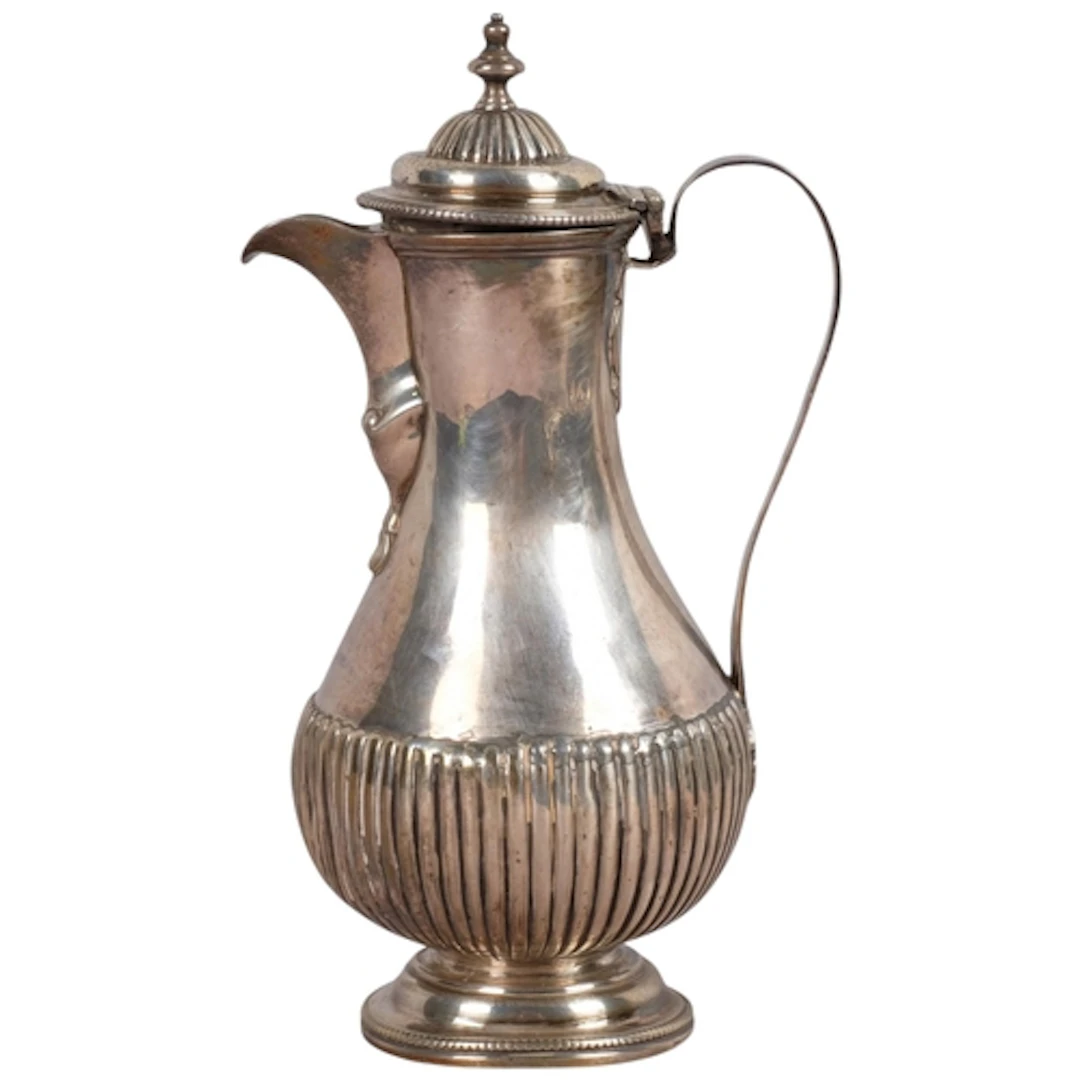 An 18th silver hot water jug, indistinct hallmarks, possibly...