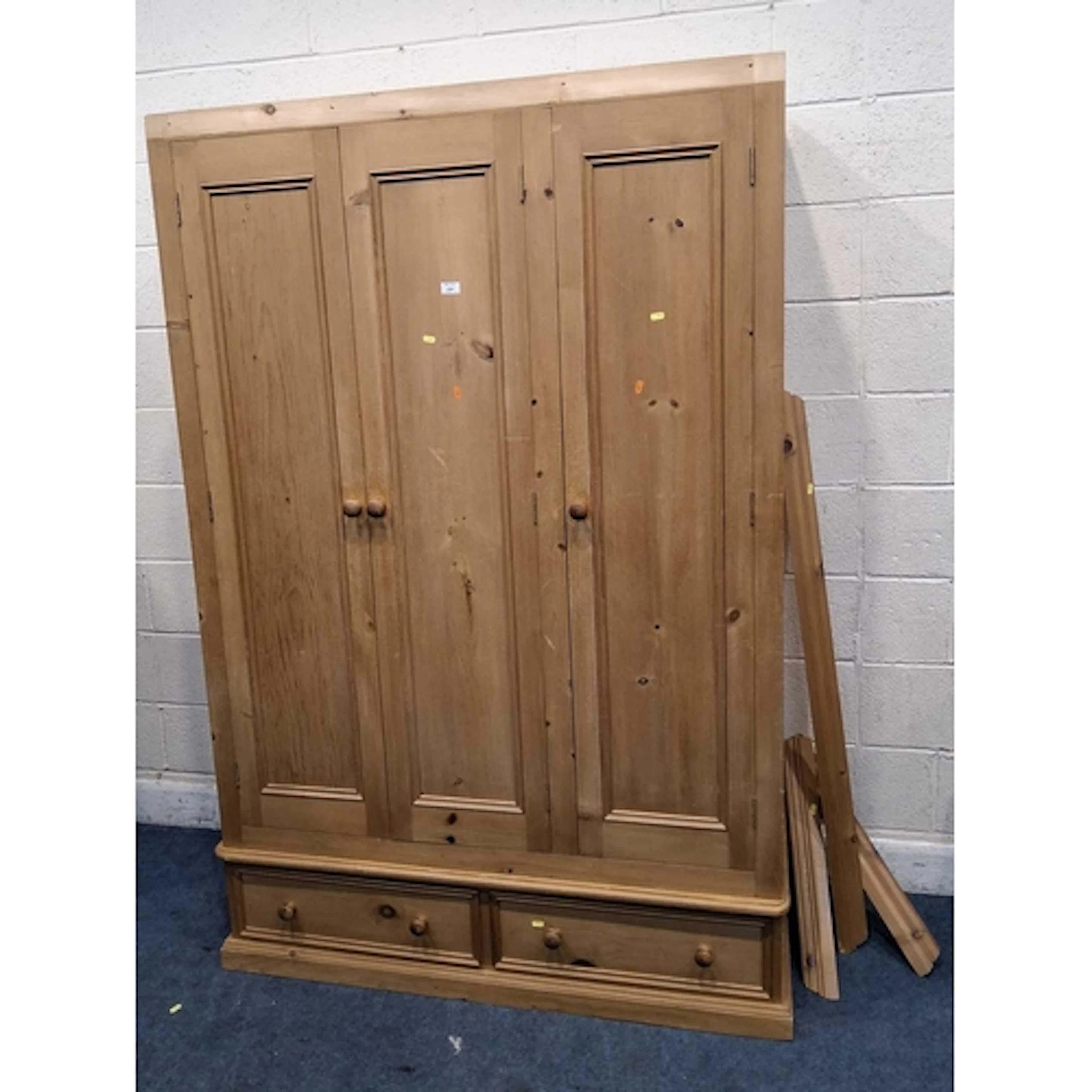 A MODERN PINE TRIPLE DOOR WARDROBE, with two drawers (width...