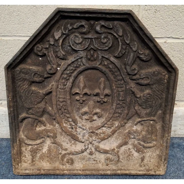 A CAST IRON FIRE BACK, depicting a French coat of arms, with...