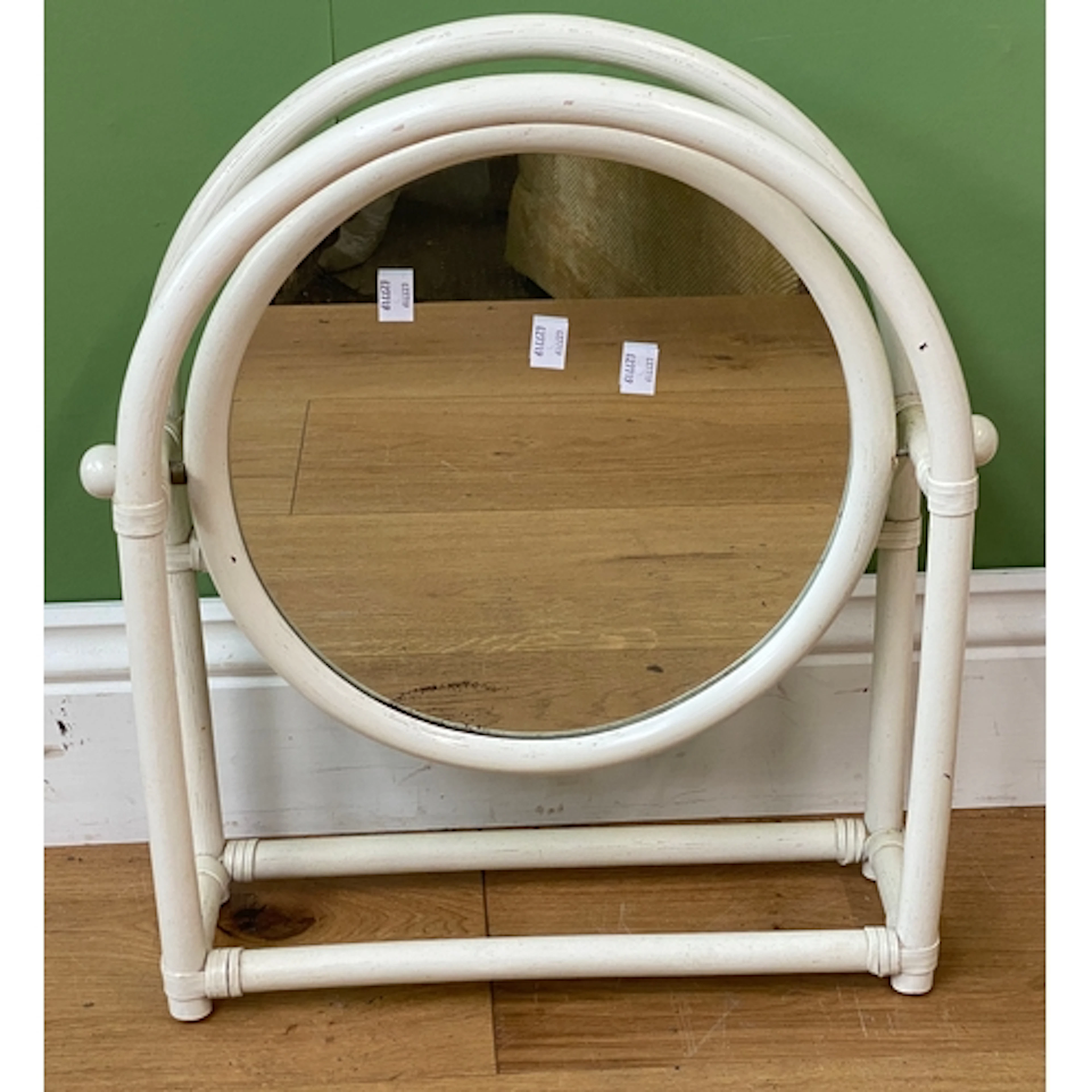 A white painted circular bamboo toilet mirror, approx. 41cmW
