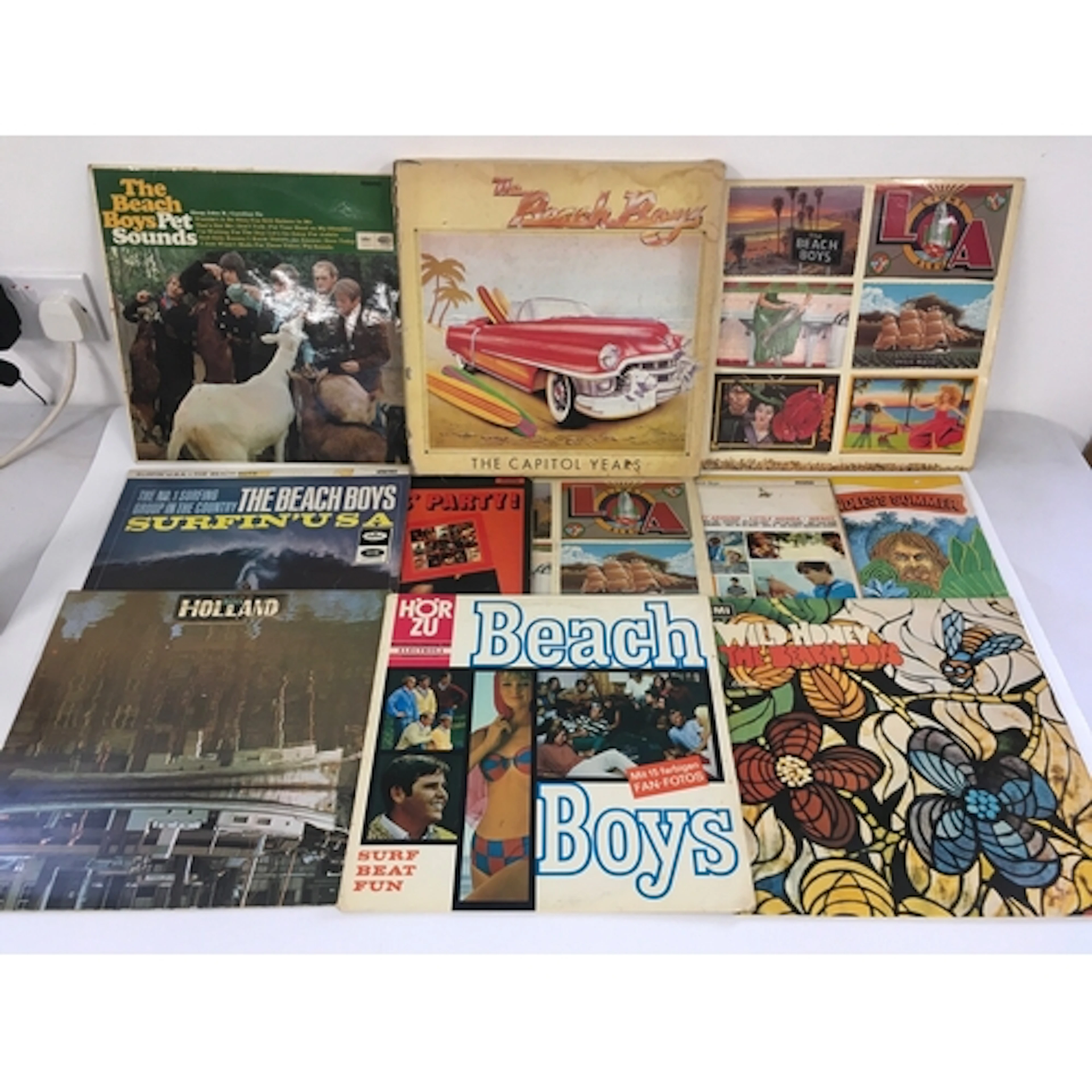Two bags containing eleven Beach Boys LPs including a multi ...