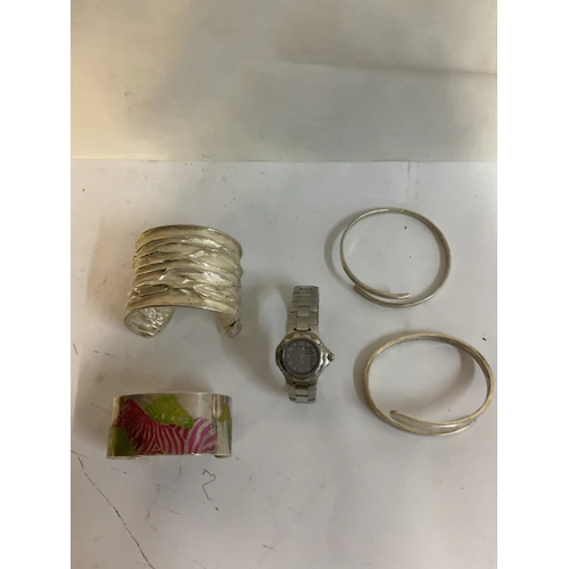 Four hallmarked silver bangles one with anodised zebras in c...
