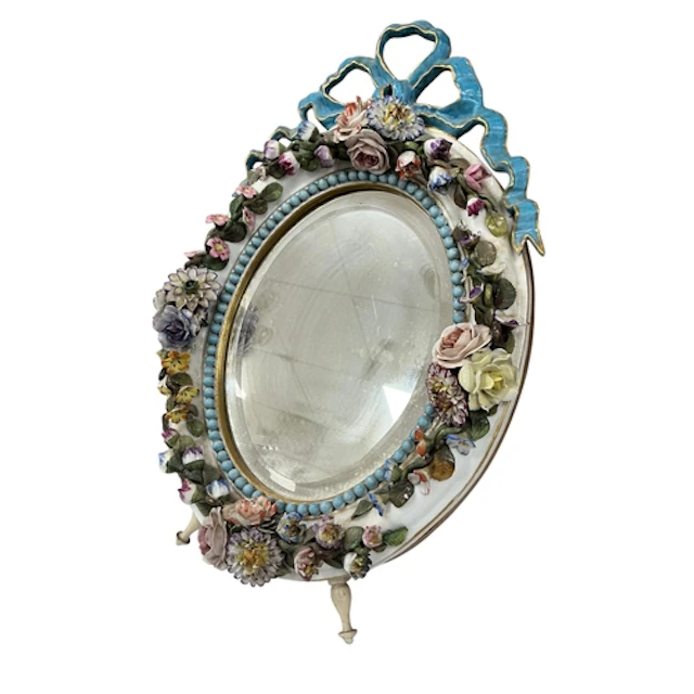 A late 19th century continental floral encrusted oval porcel...