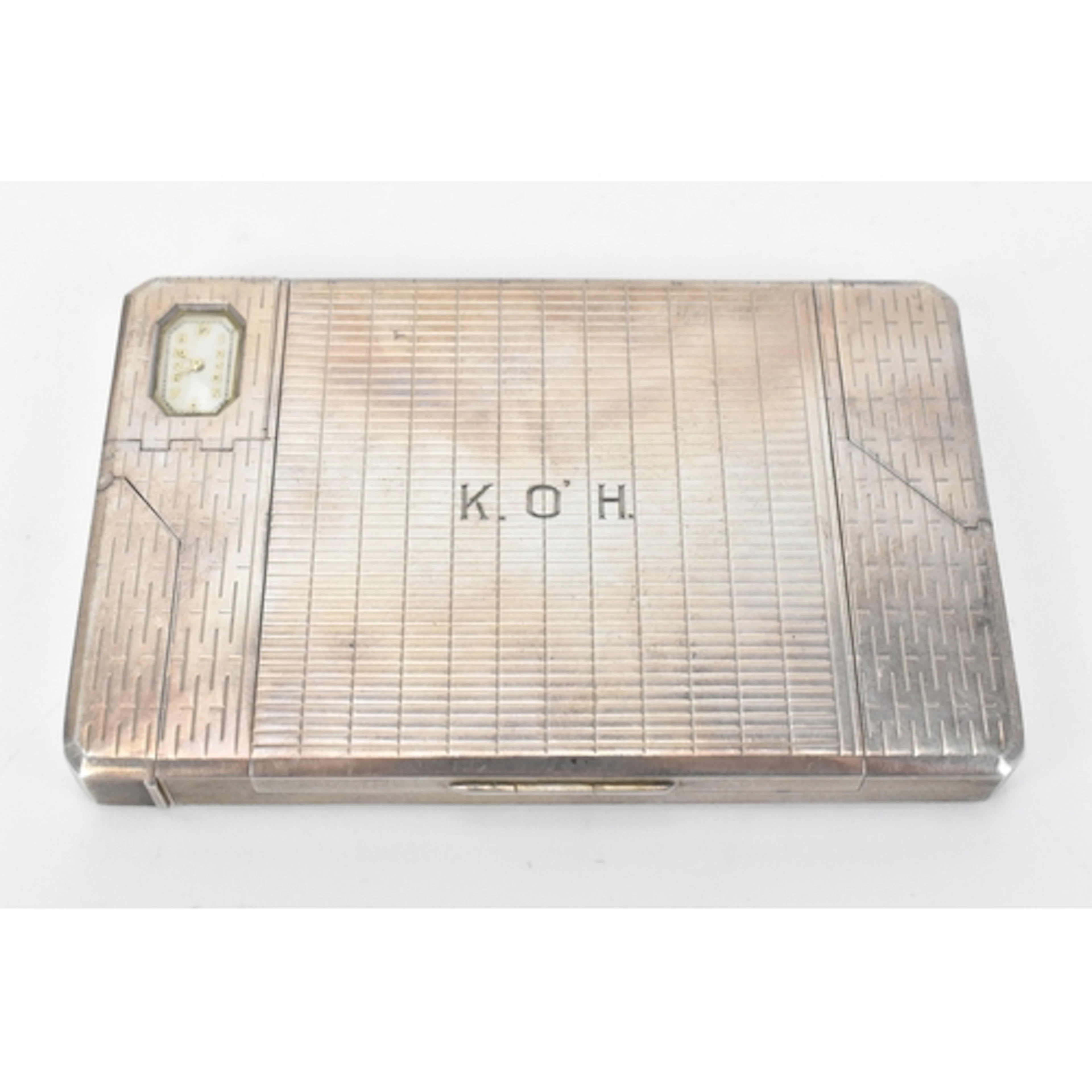 A rare silver combination cigarette case, by Alfred Dunhill ...