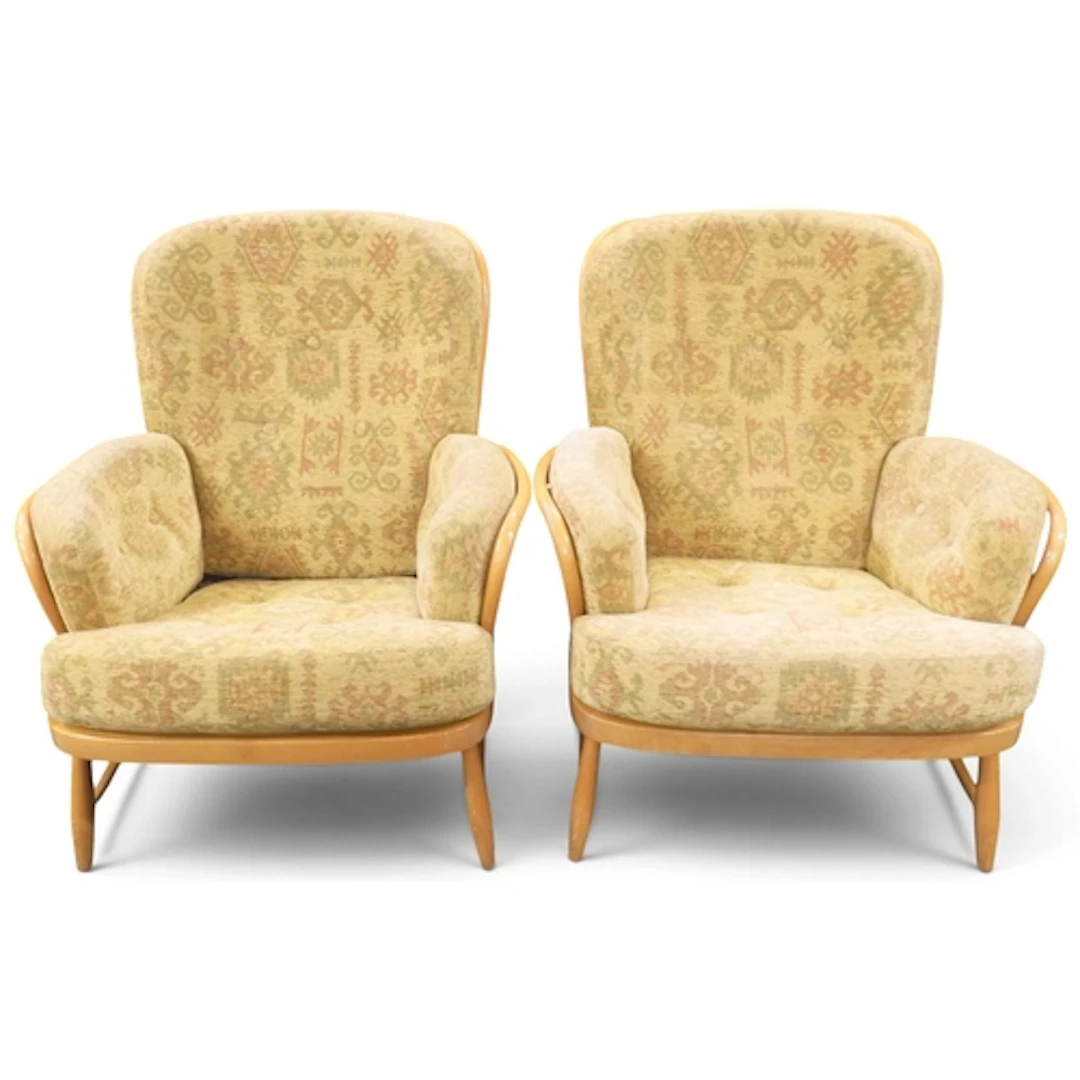 A pair of Ercol elm and beech framed armchairs with yellow g...