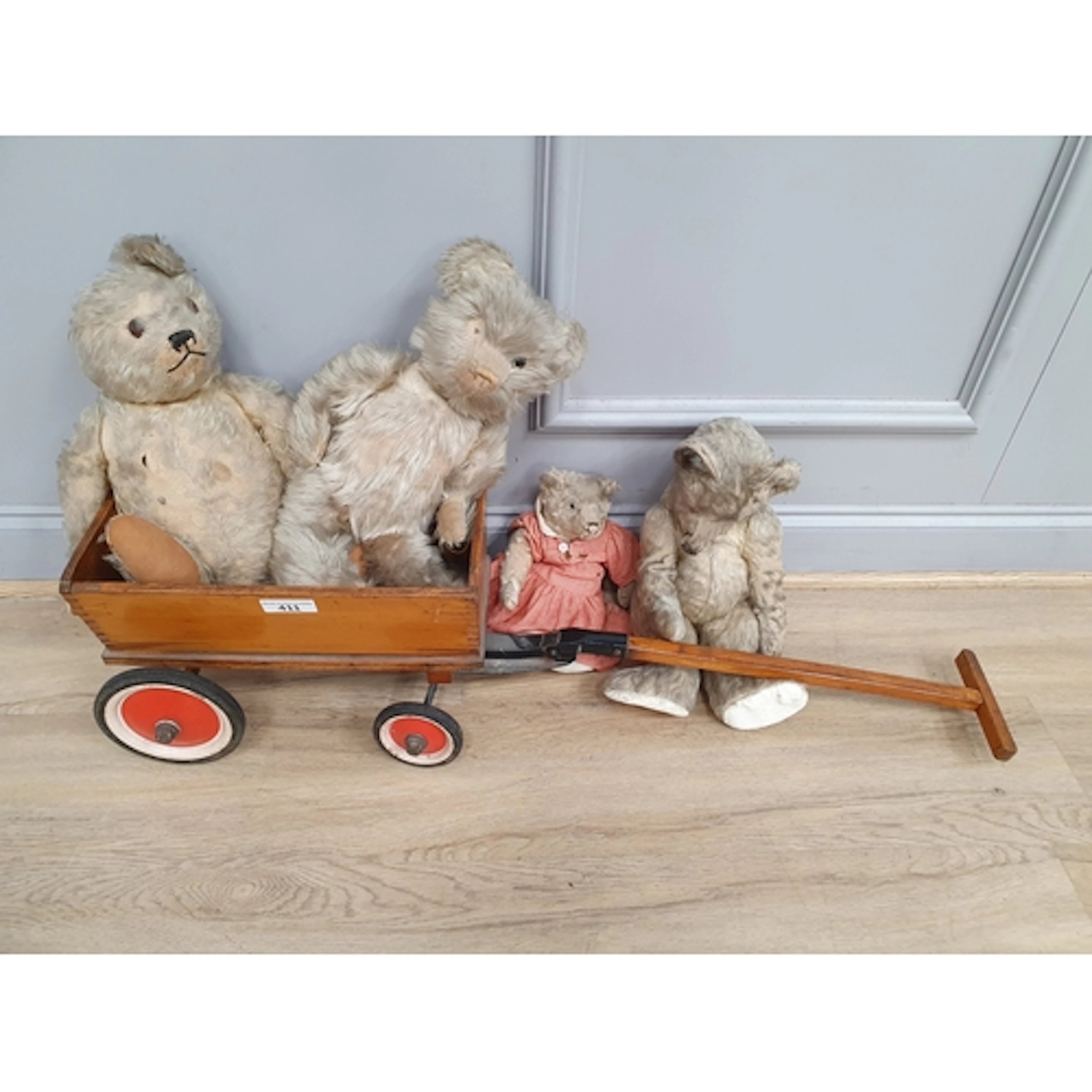 A child's four wheel Cart, red stencilled Steiff, 3ft, and f...
