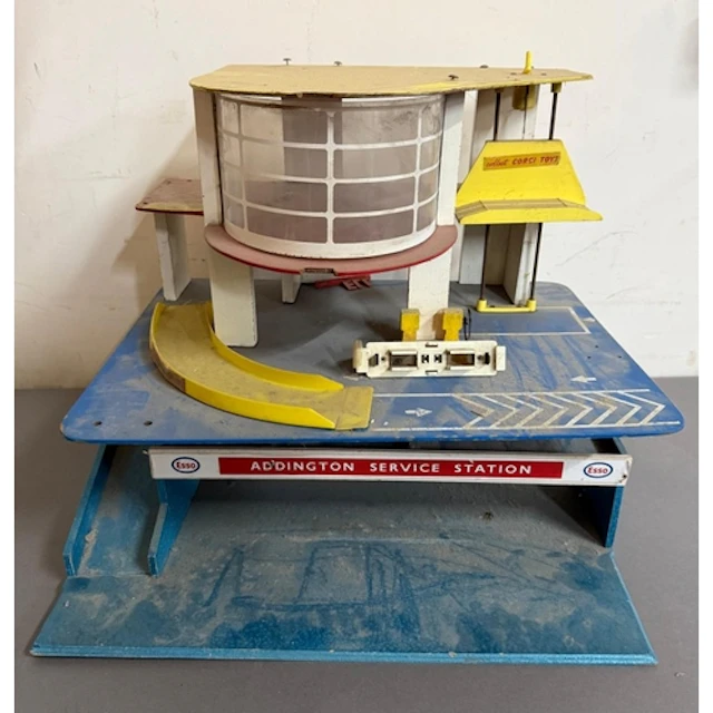 A vintage toy Addington service station together with a vint...