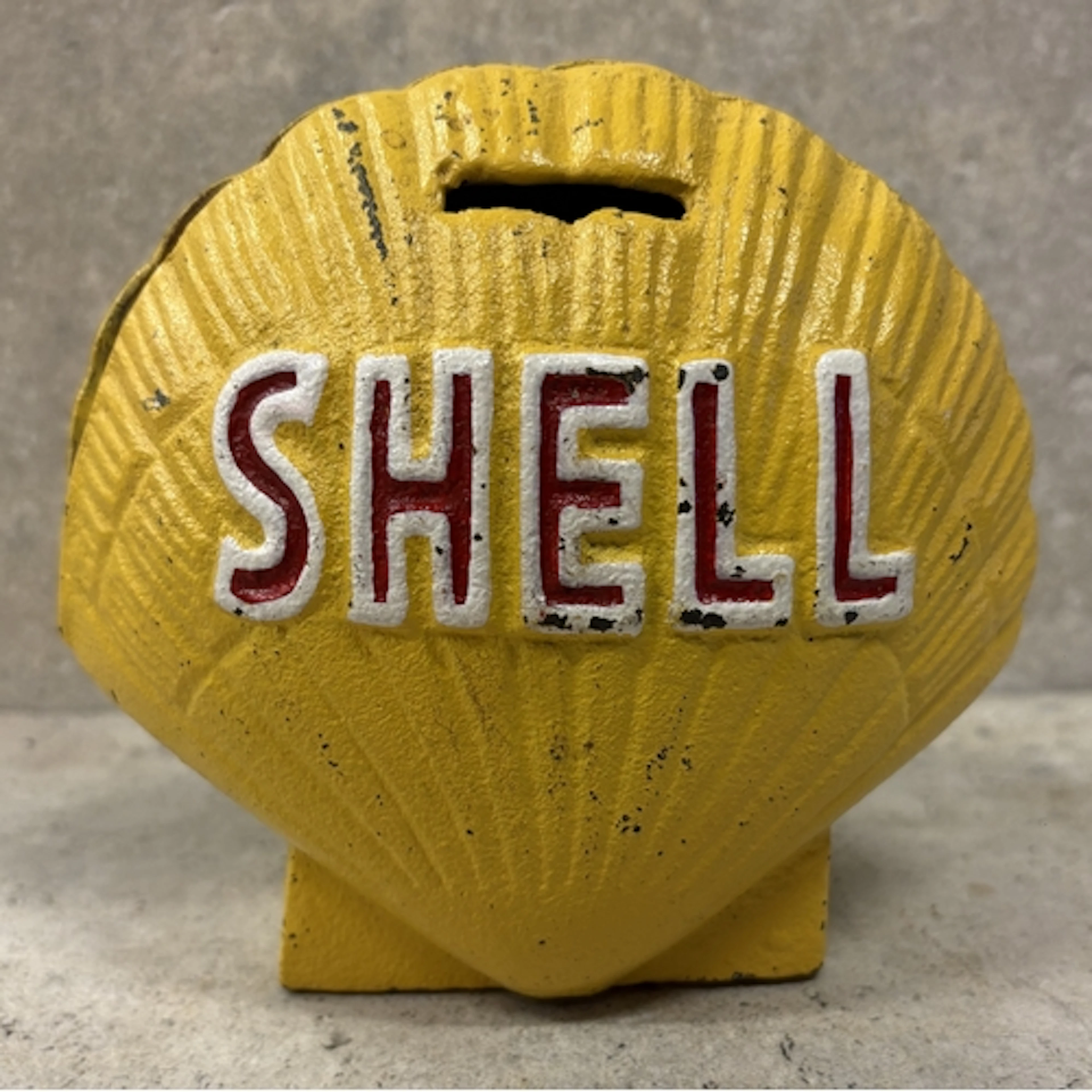 A cast iron "Shell" money box in the form of a petrol pump g...