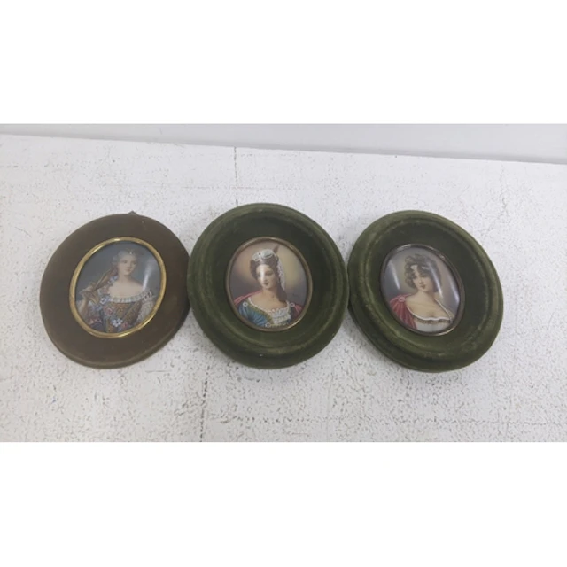 Three mid 20th century portrait miniatures to include a pair...