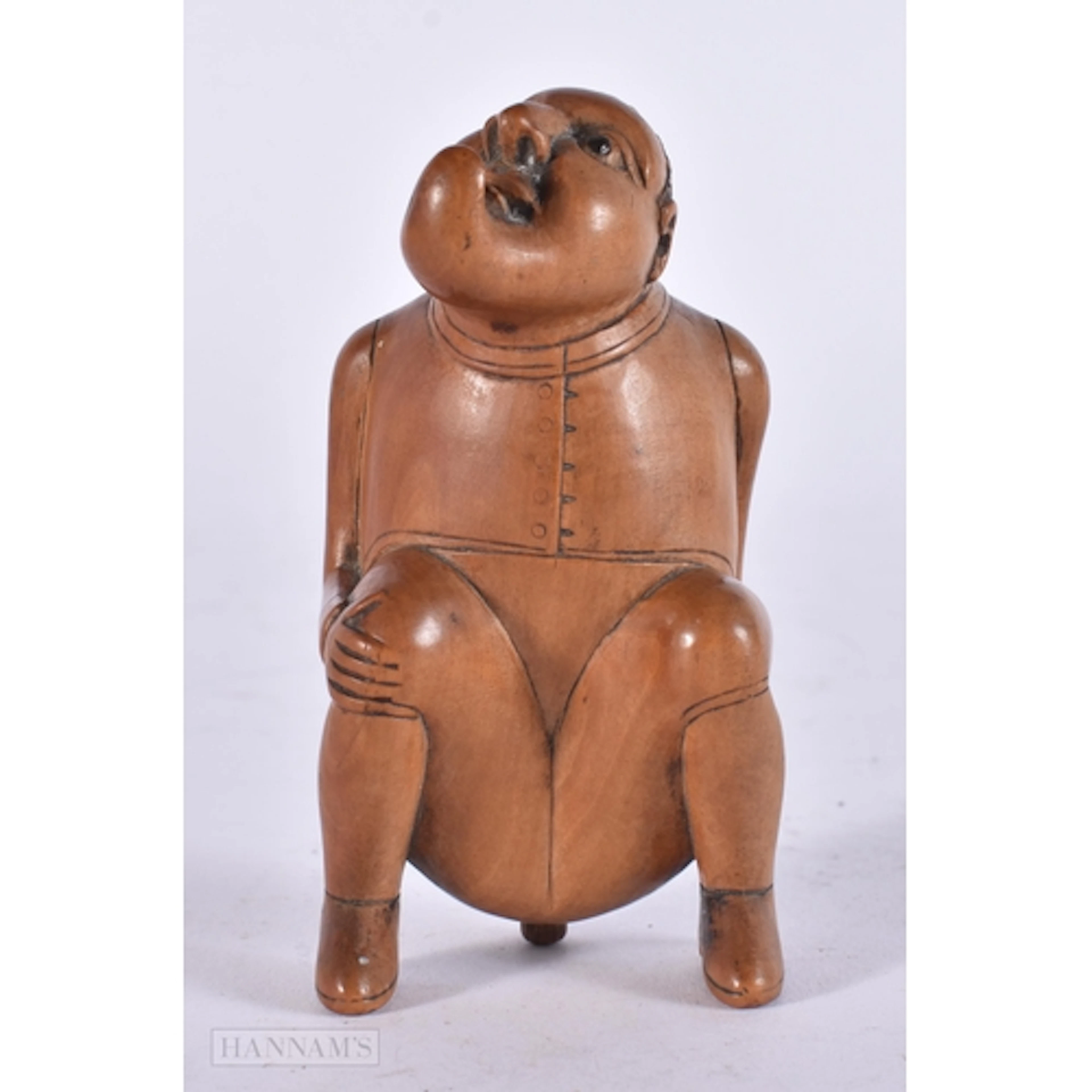 AN 18TH/19TH CENTURY TREEN CARVED WOOD 'DEFECATING MALE' SNU...