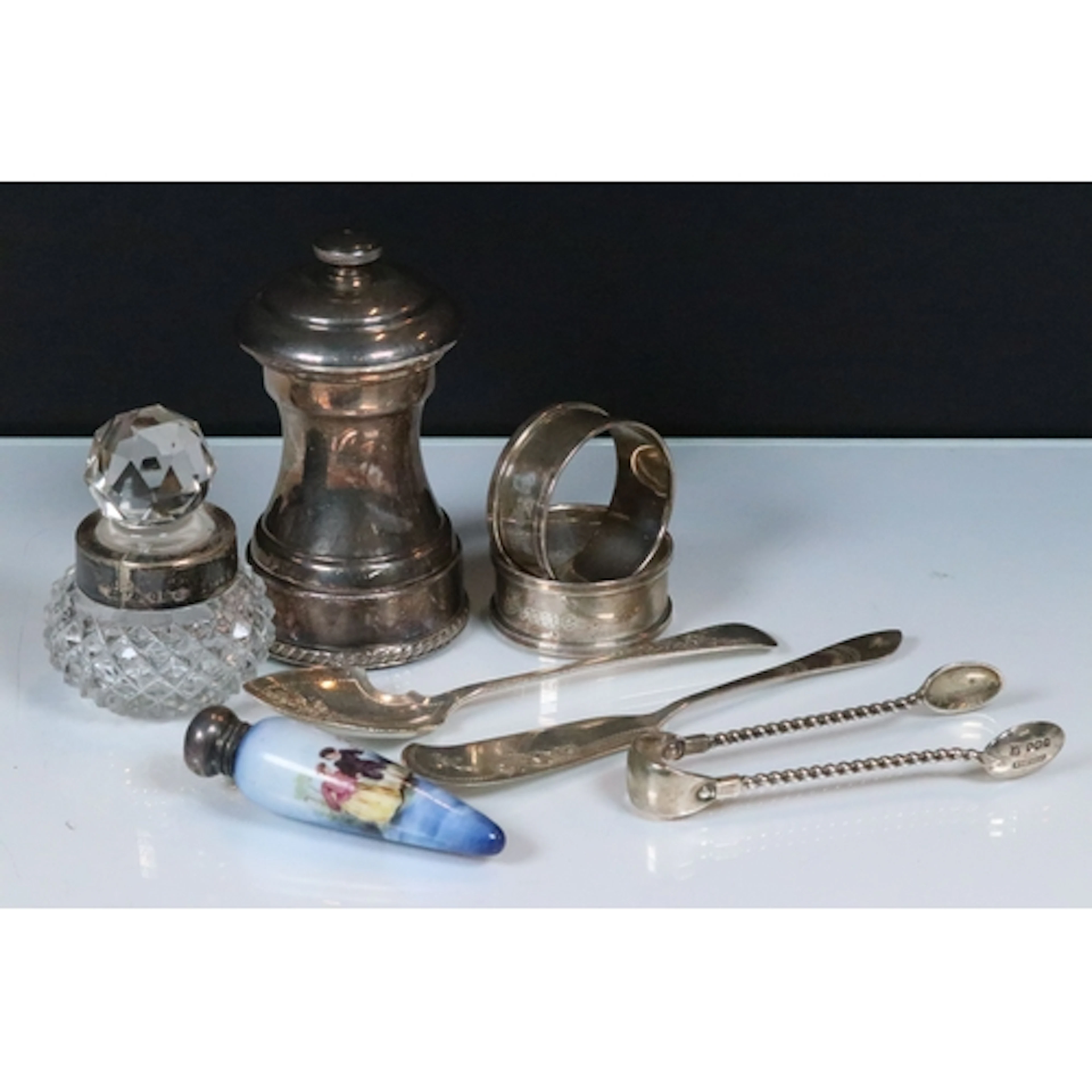 Group of silver hallmarked items to include a silver pepper ...
