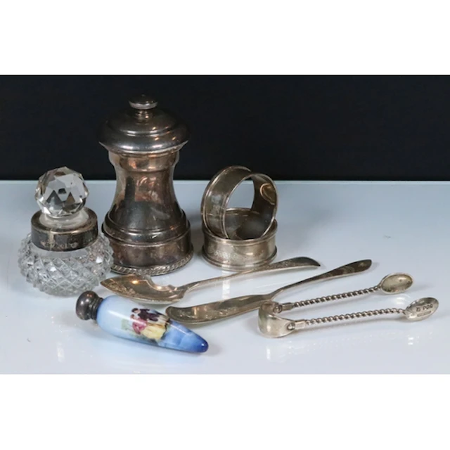 Group of silver hallmarked items to include a silver pepper ...