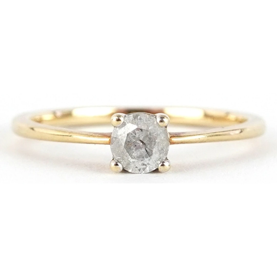 10K gold diamond solitaire ring, the diamond approximately 0...